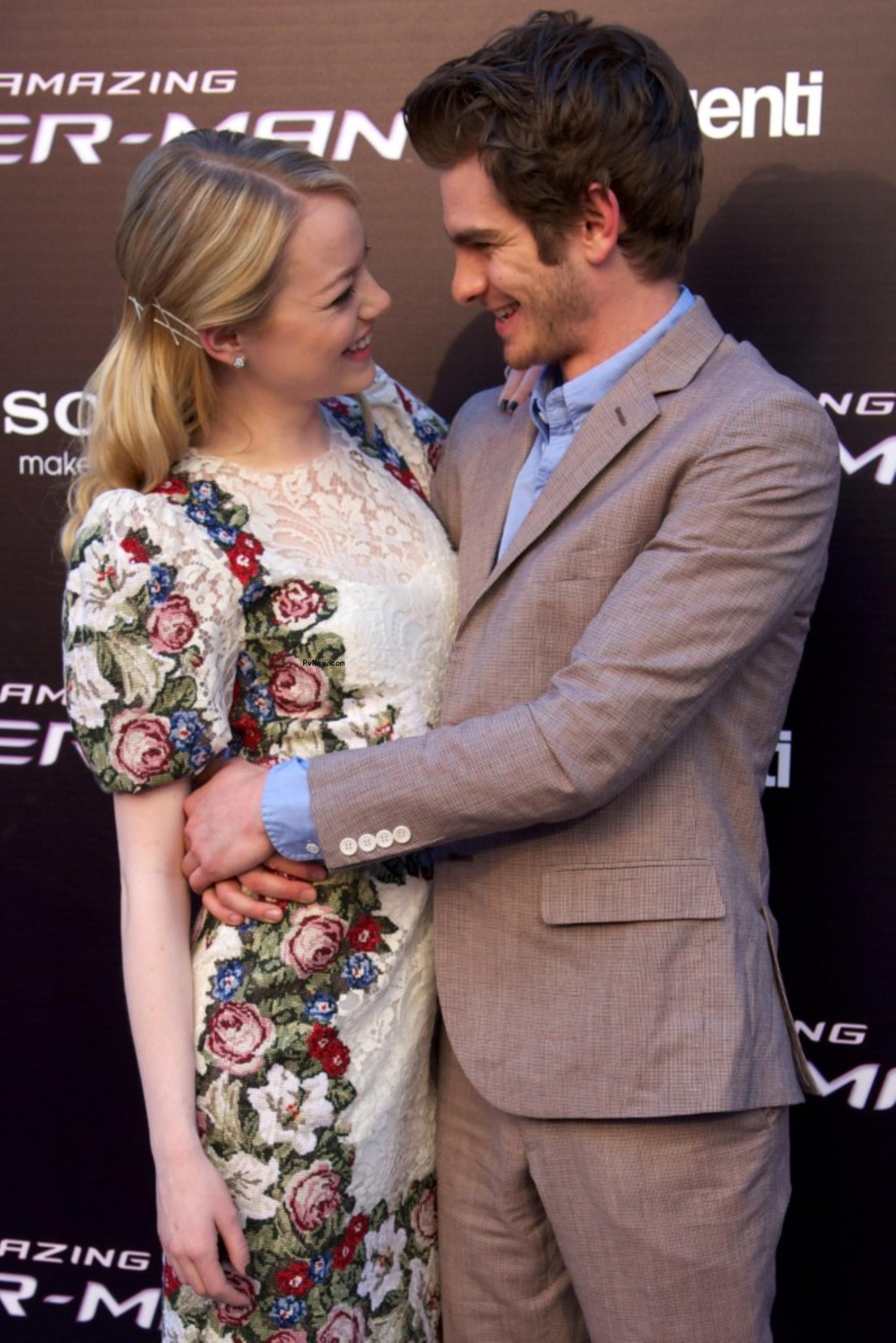 Emma Stone and Andrew Garfield on a red carpet. 