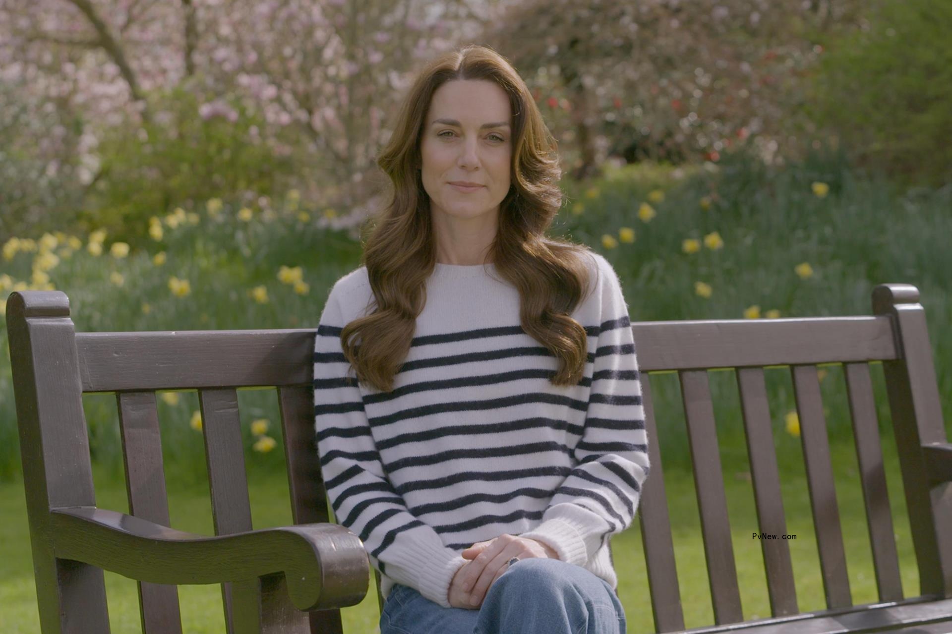 Kate Middleton sitting on a bench