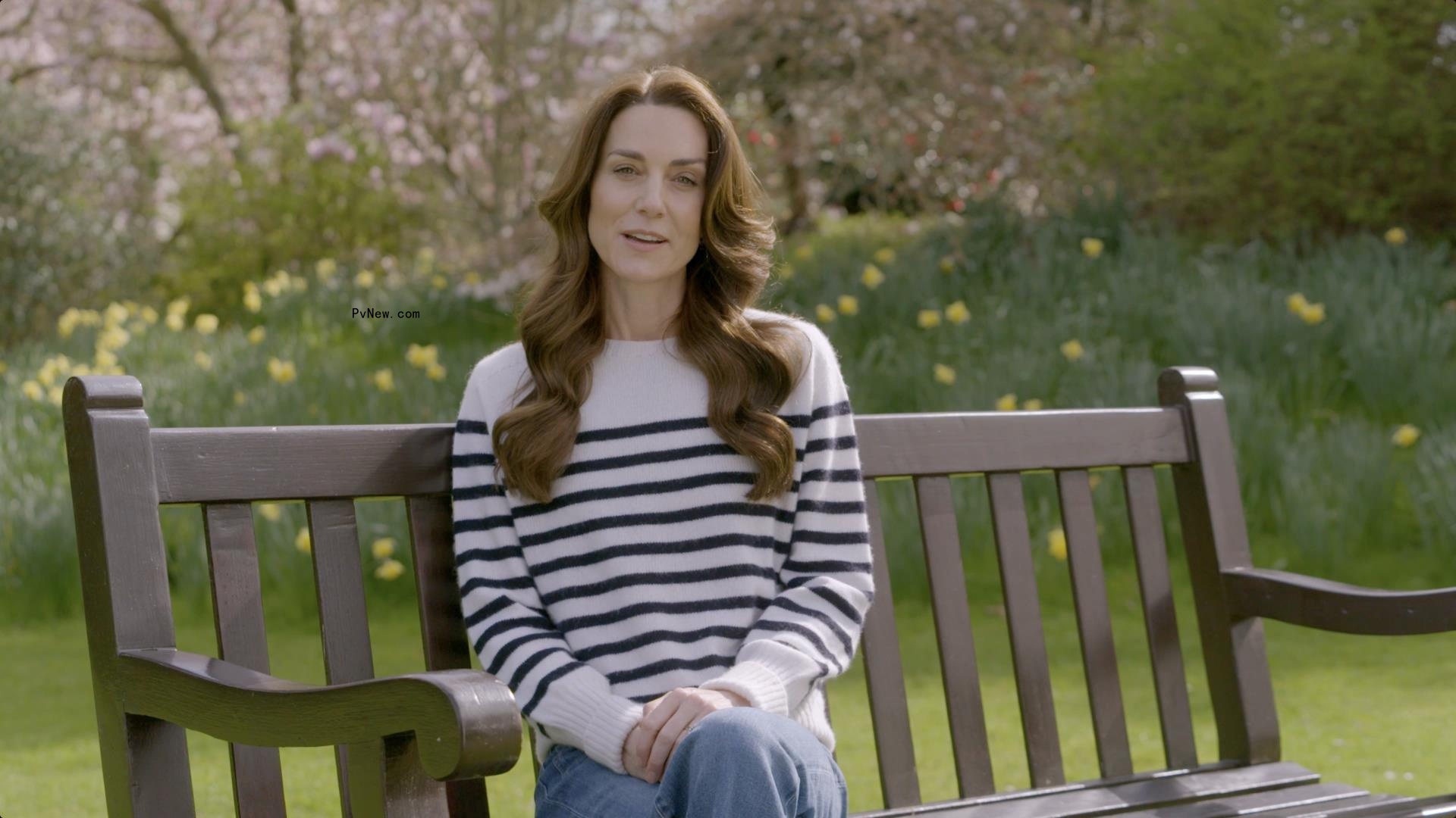 Kate Middleton sitting on a bench