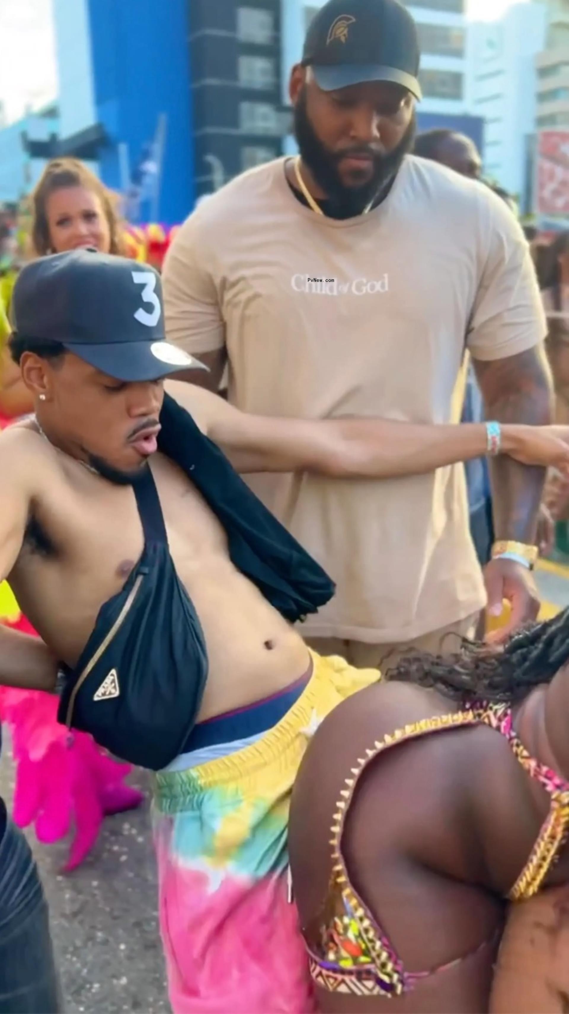 Chance the Rapper dancing with a woman.