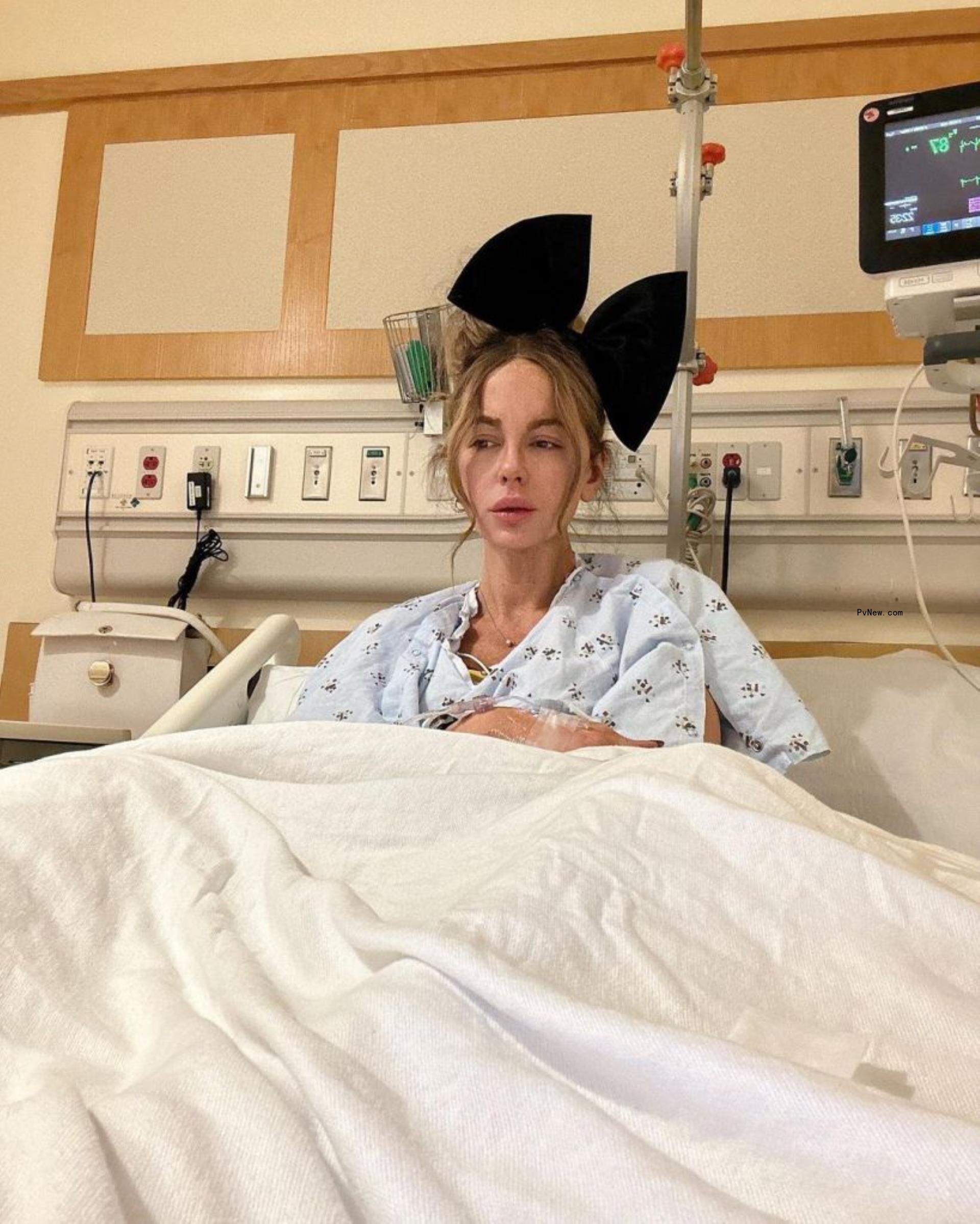 Kate Beckinsale in a hospital bed. 