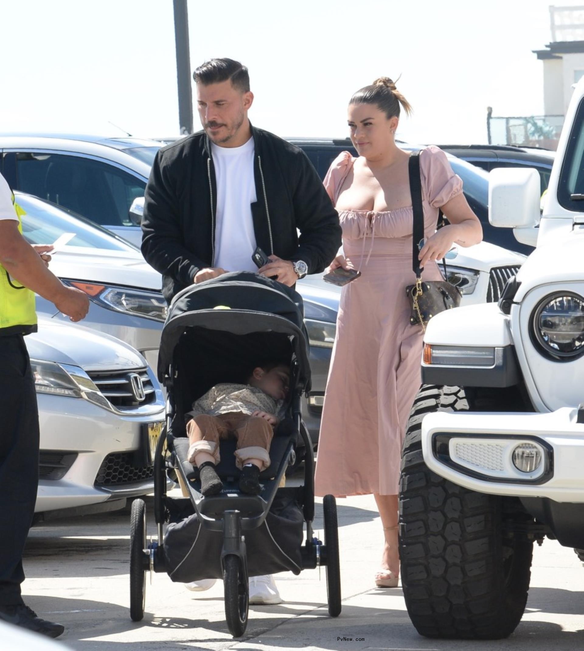 Jax Taylor and Brittany Cartwright pushing Cruz in a stroller.