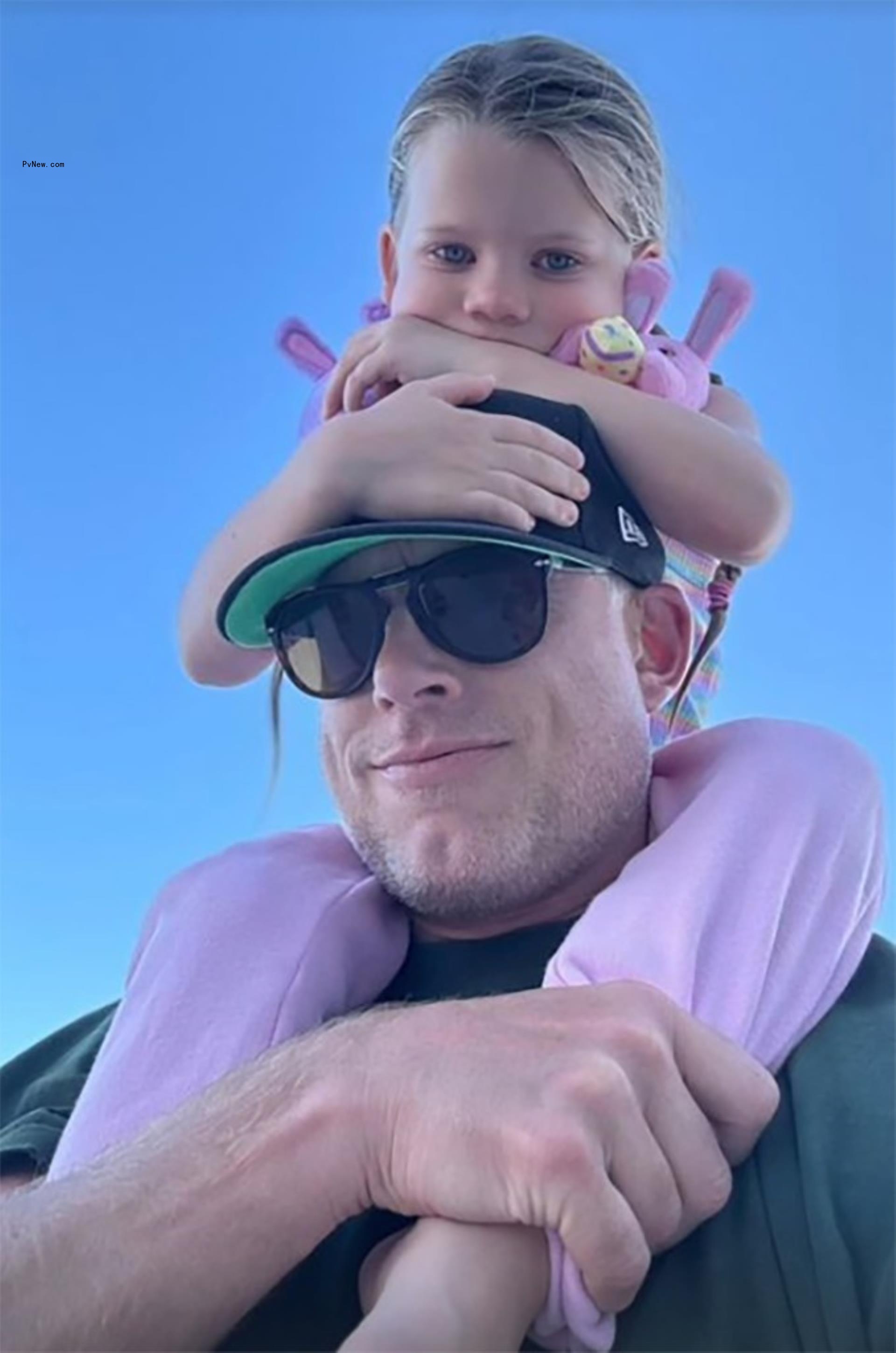 Birdie on Eric Johnson's shoulders in Cabo San Lucas, Mexico.