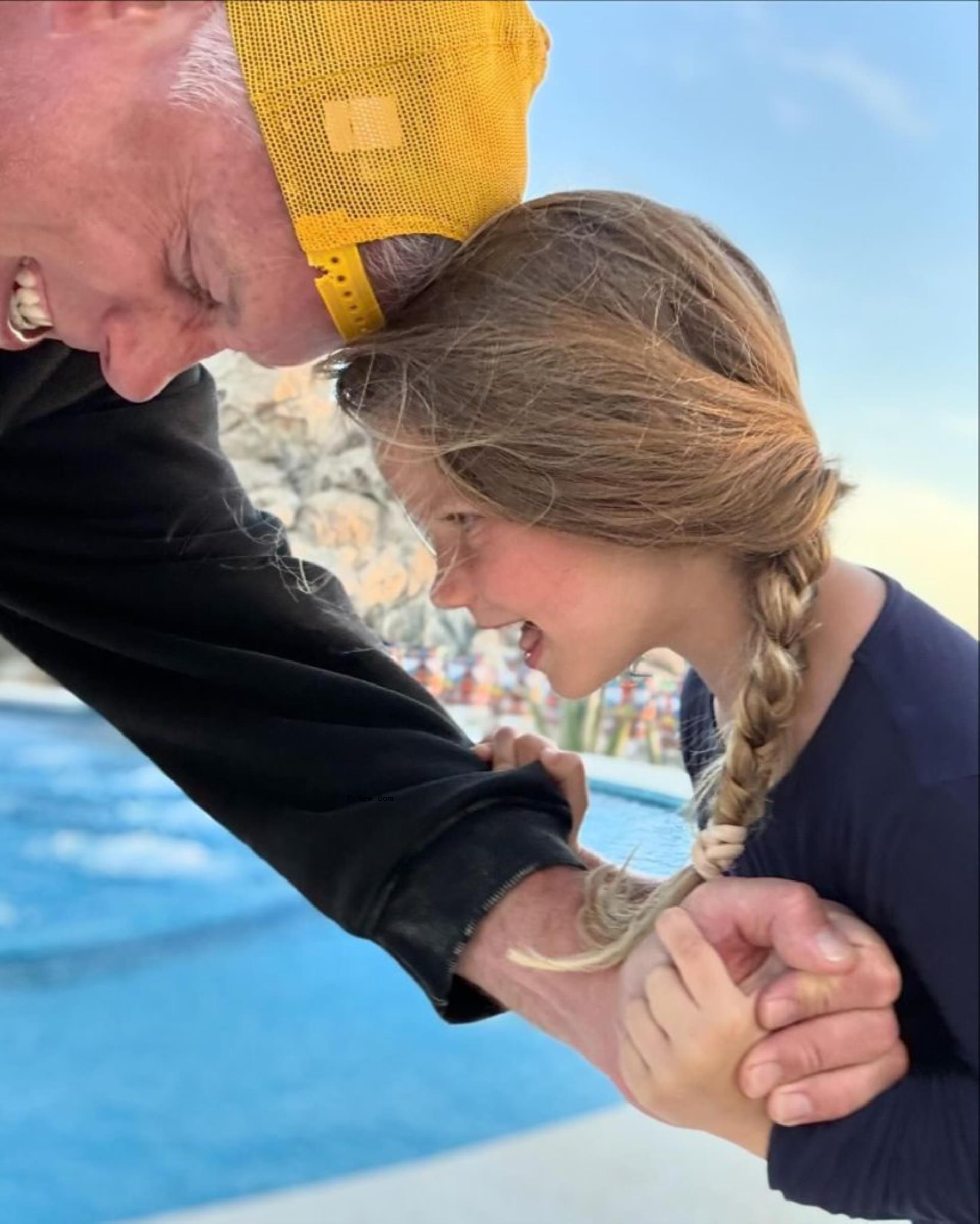 Eric Johnson and his daughter at the pool in Cabo San Lucas, Mexico.
