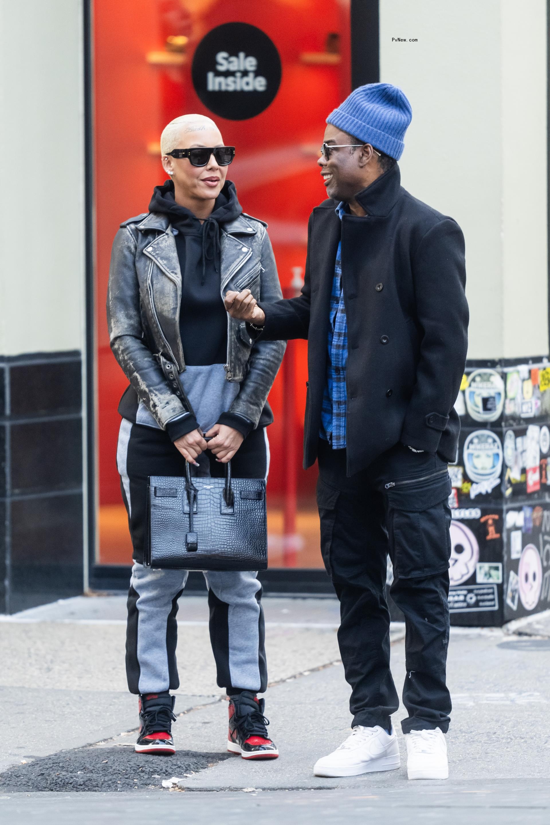 amber rose and chris rock on a street corner