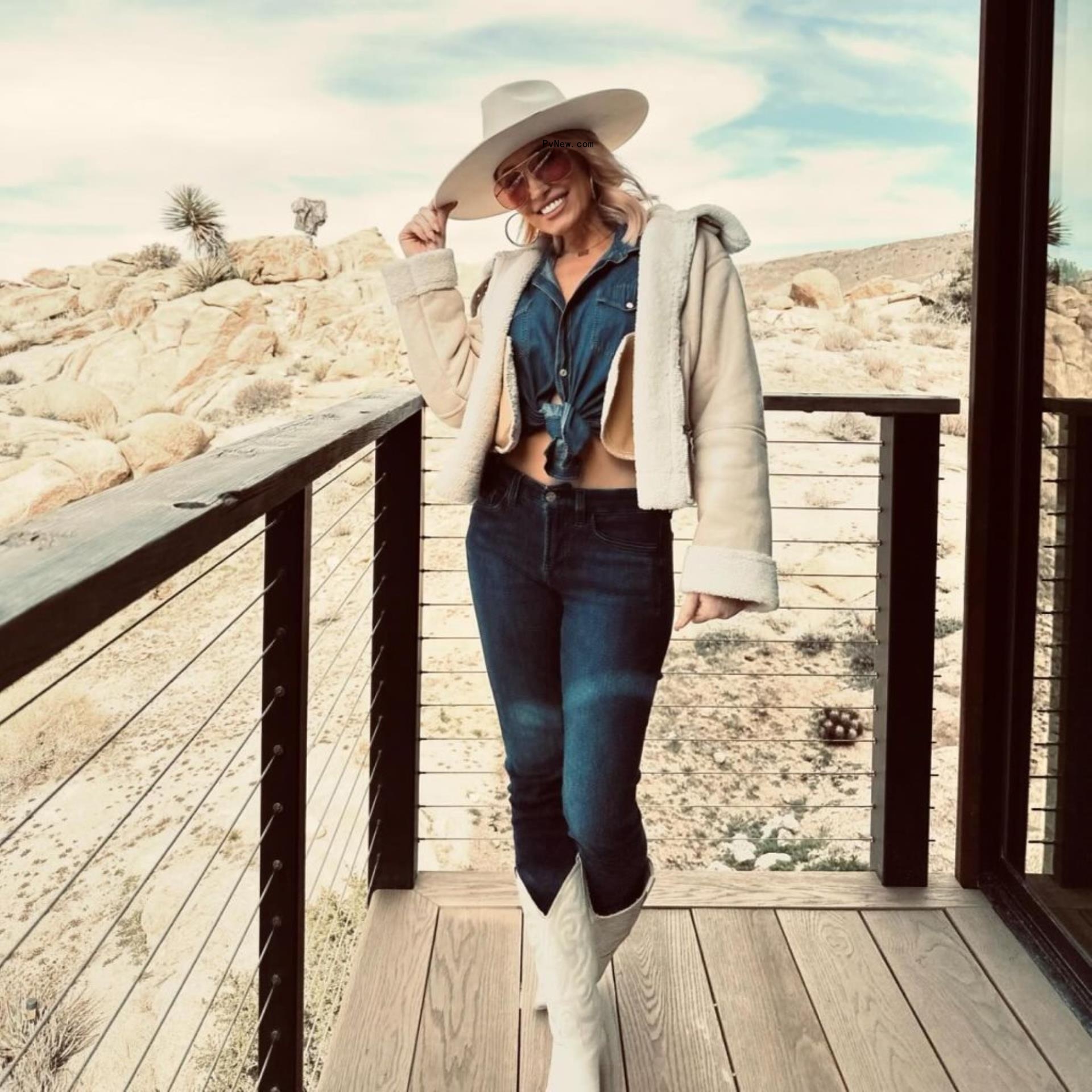 mary fitzgerald posing on a balcony in the desert