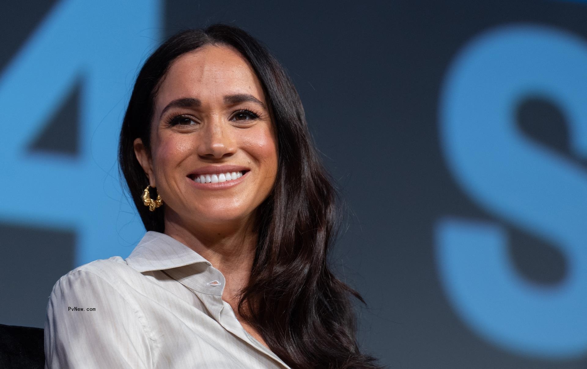 Meghan Markle smiling.