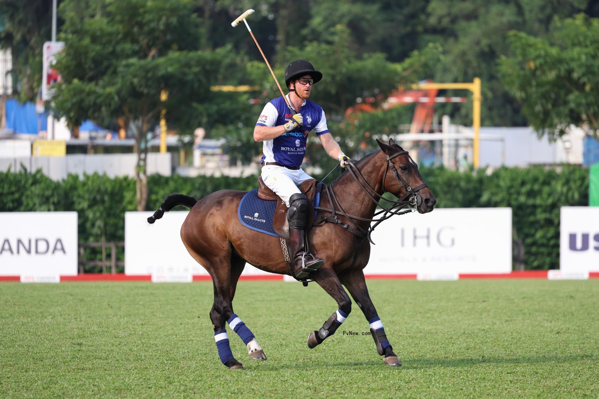 Prince Harry playing polo.