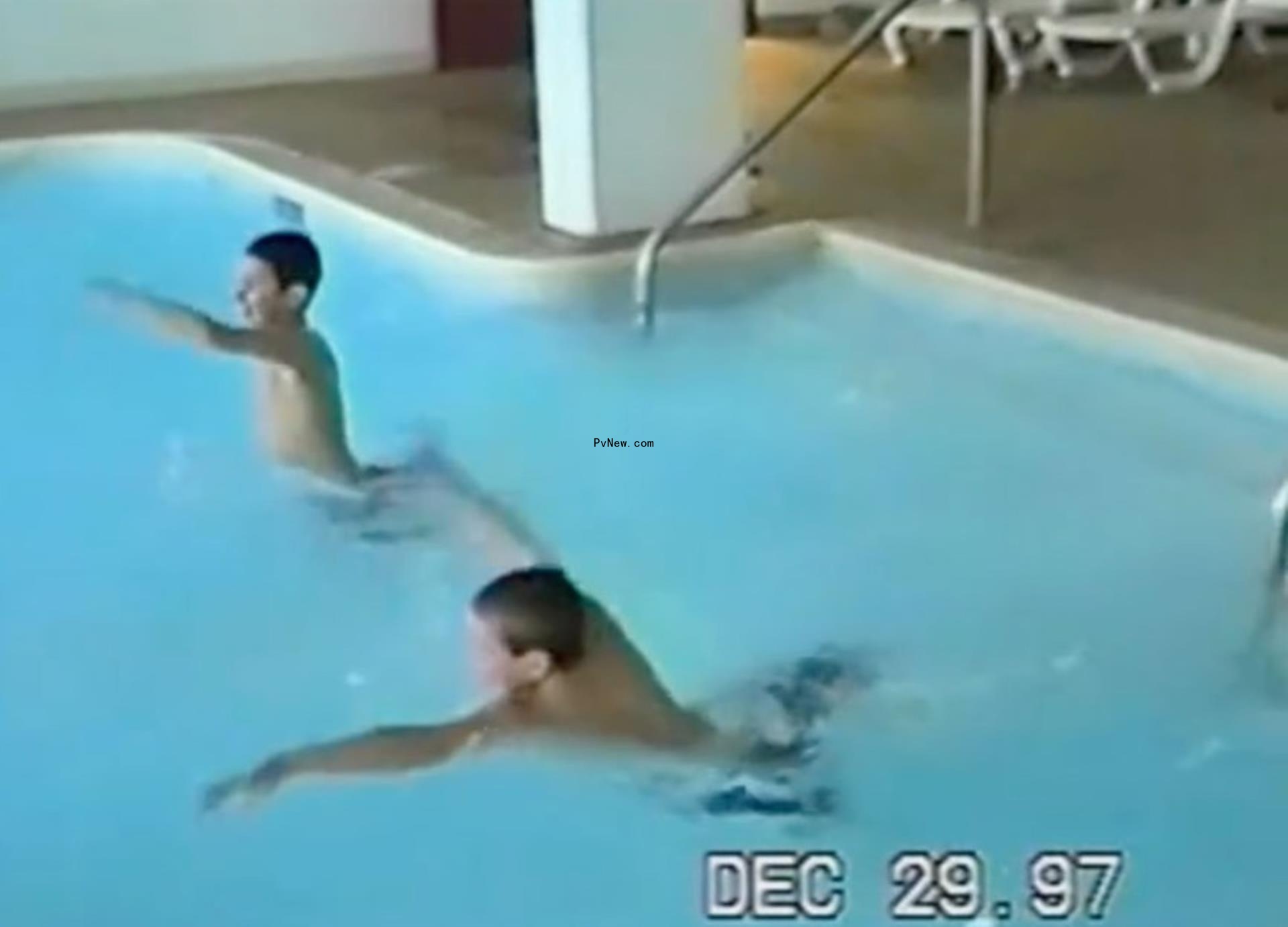 Travis and Jason Kelce swimming together as kids.
