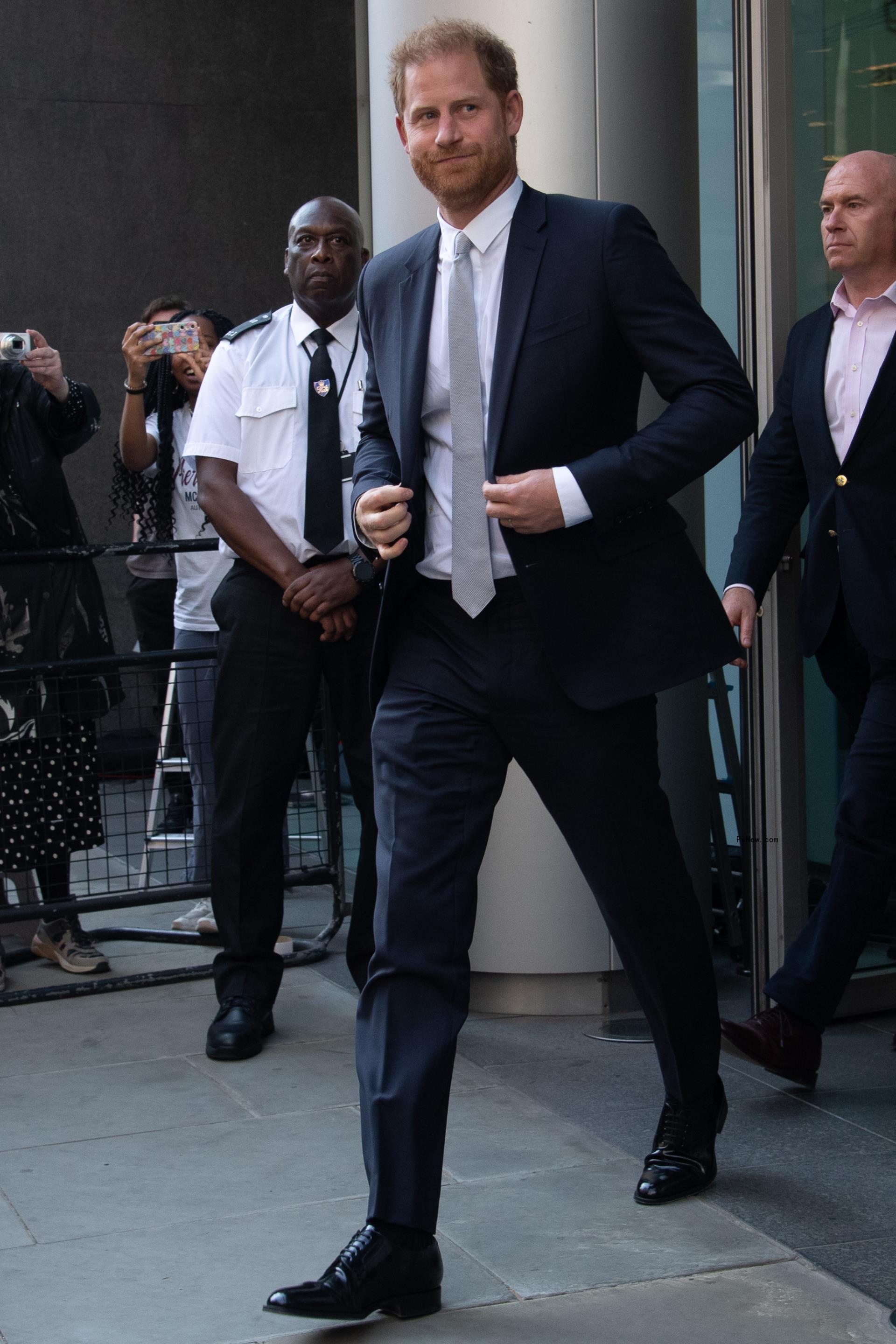 Prince Harry walking out of court.
