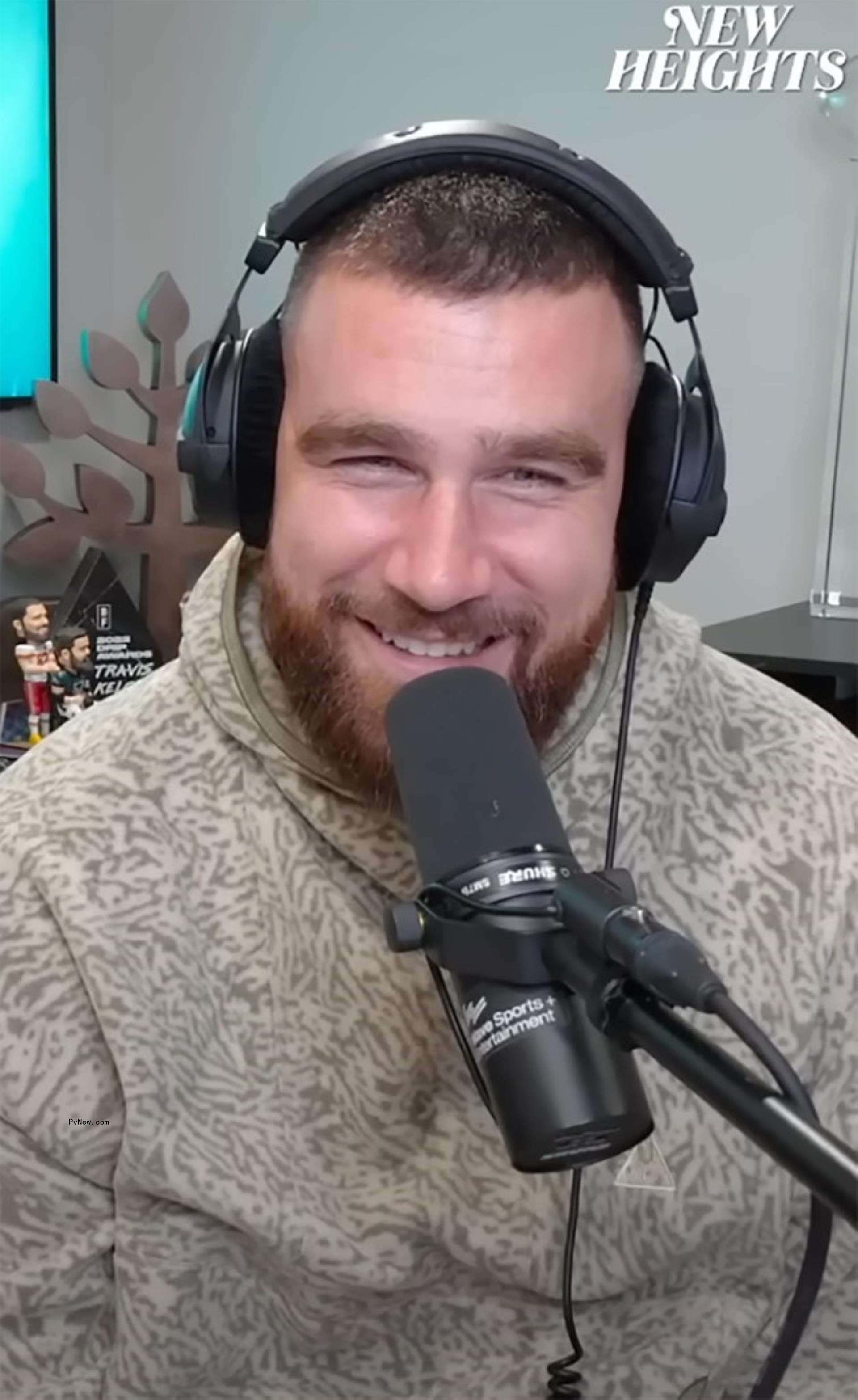 Travis Kelce podcasting.