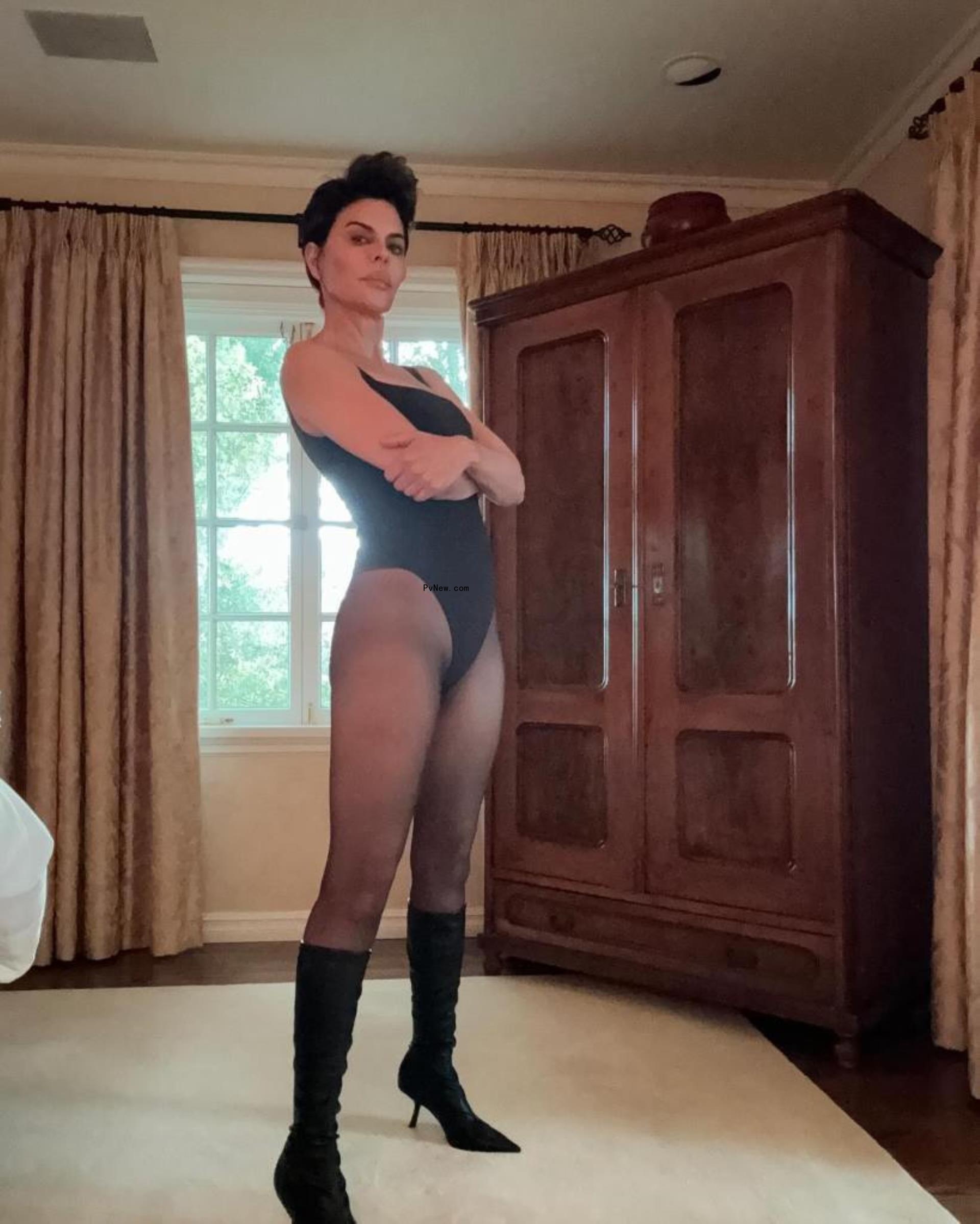 Lisa Rinna in a black leotard and tights.