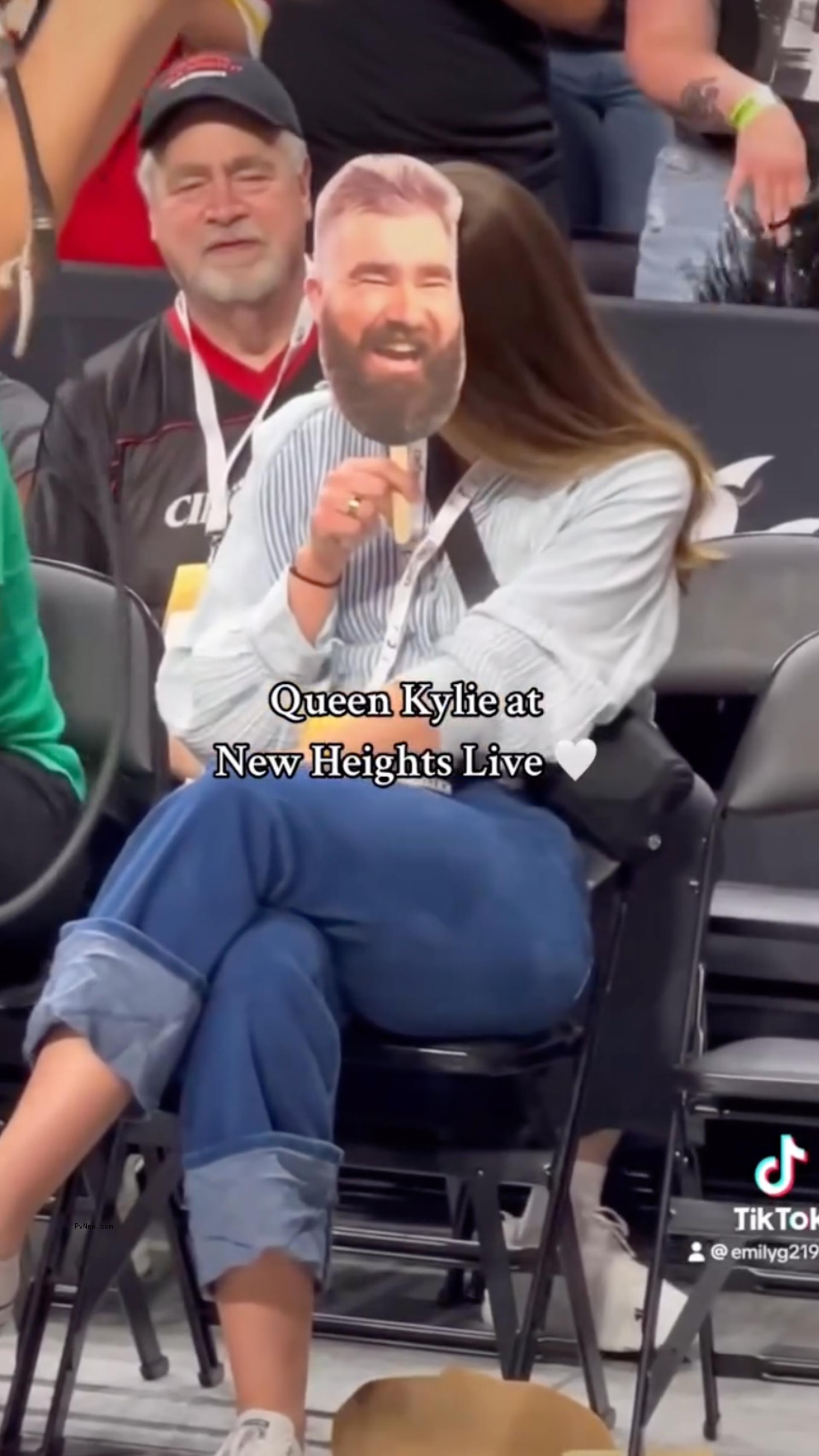 Kylie Kelce holding a Jason Kelce cutout.