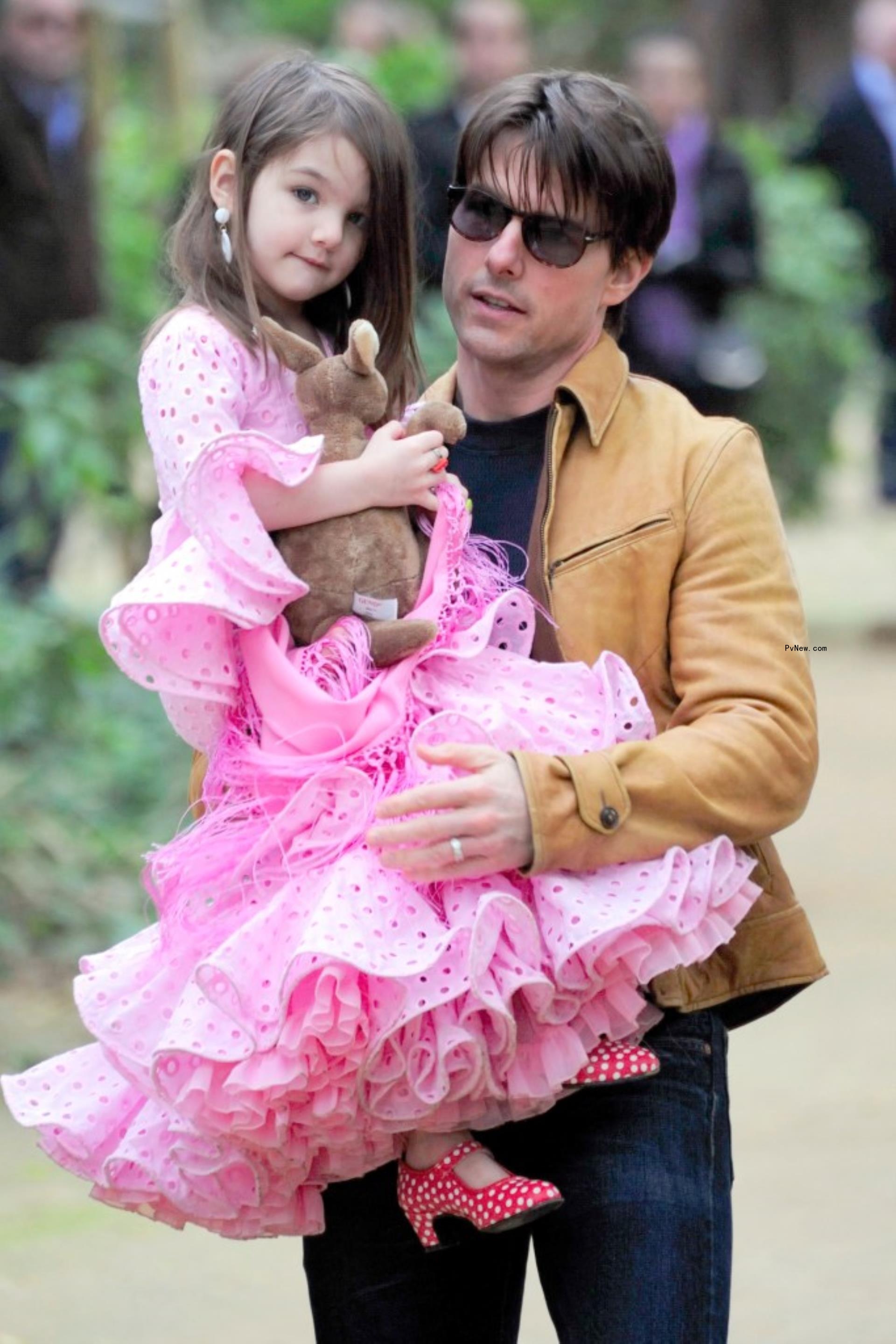 Tom Cruise holds Suri Cruise as they leave her gymnastics class in NYC in July 2012.