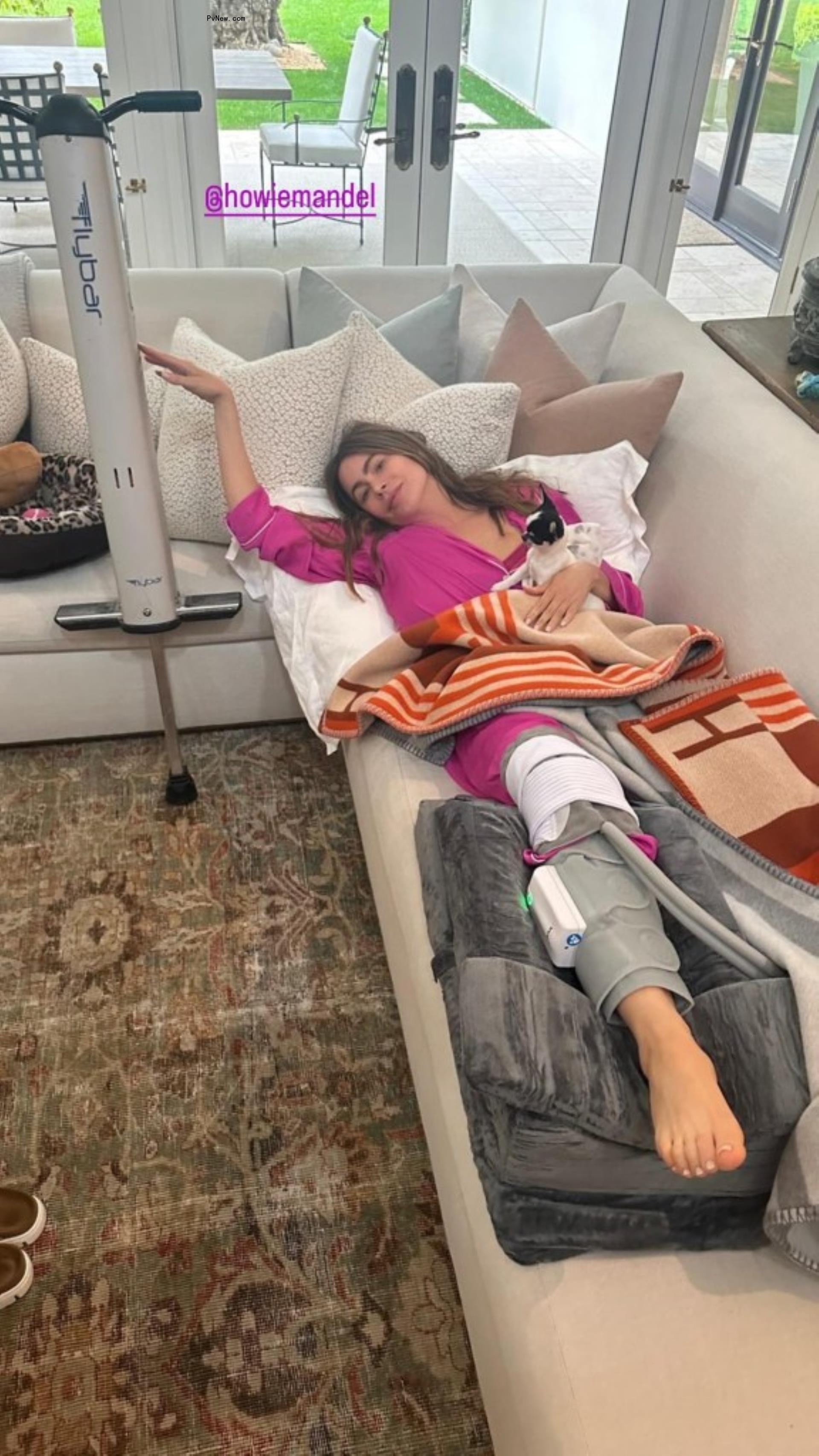 Sofia Vergara poses for photo on couch