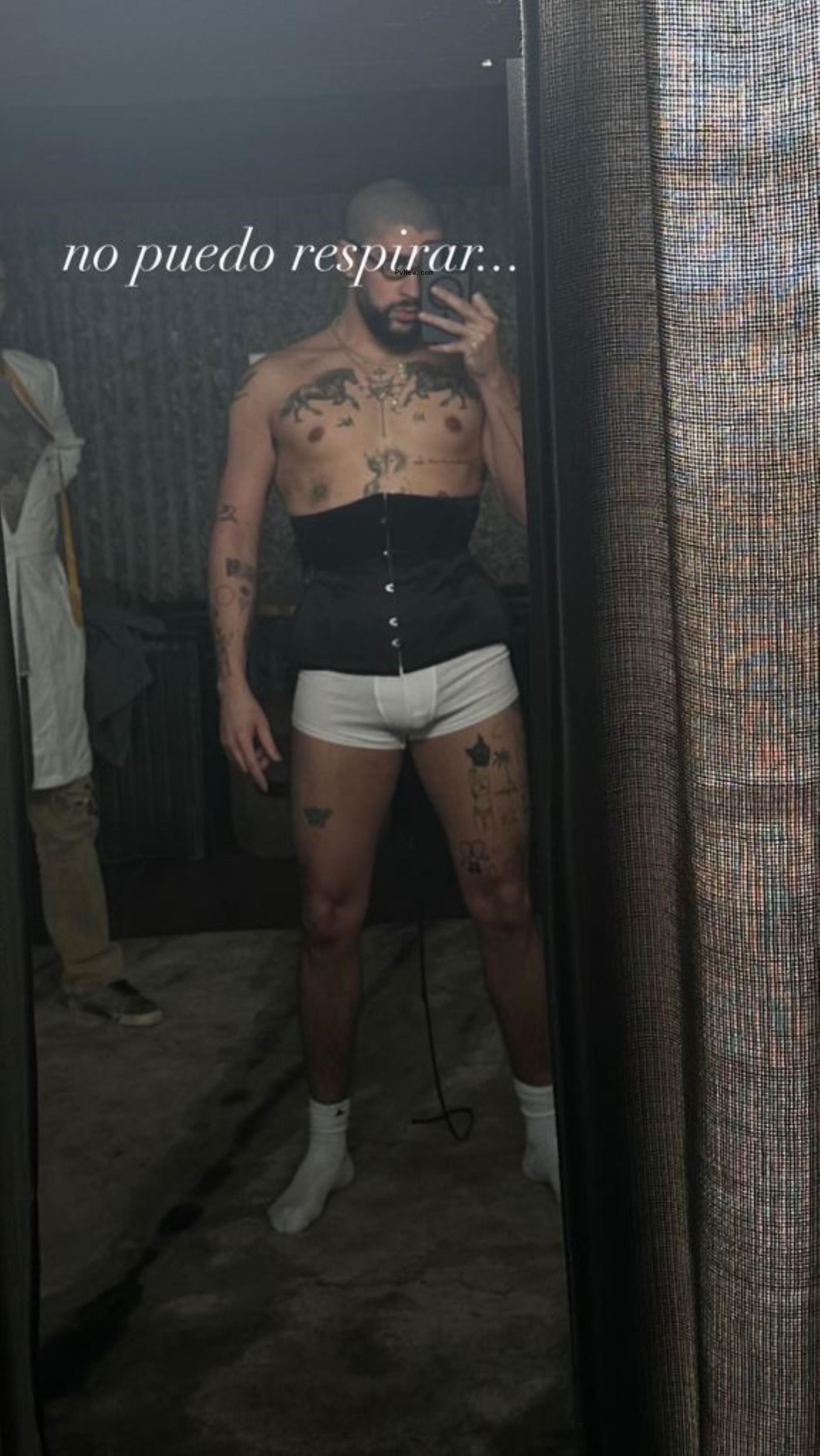 Bad Bunny selfie in a corset and boxer briefs.