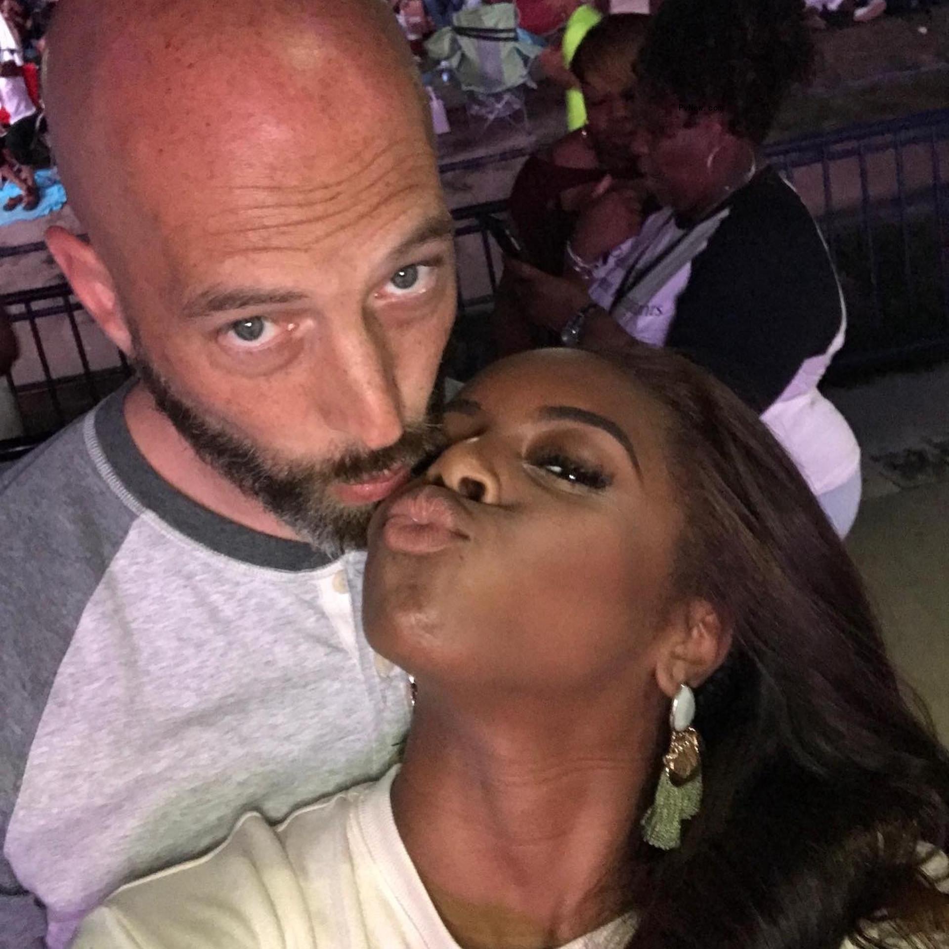 Candiace Dillard and Chris Bassett kissing selfie.