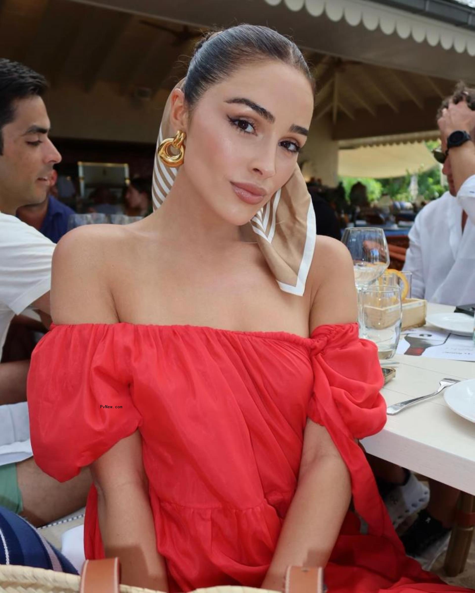 Olivia Culpo in a red dress.