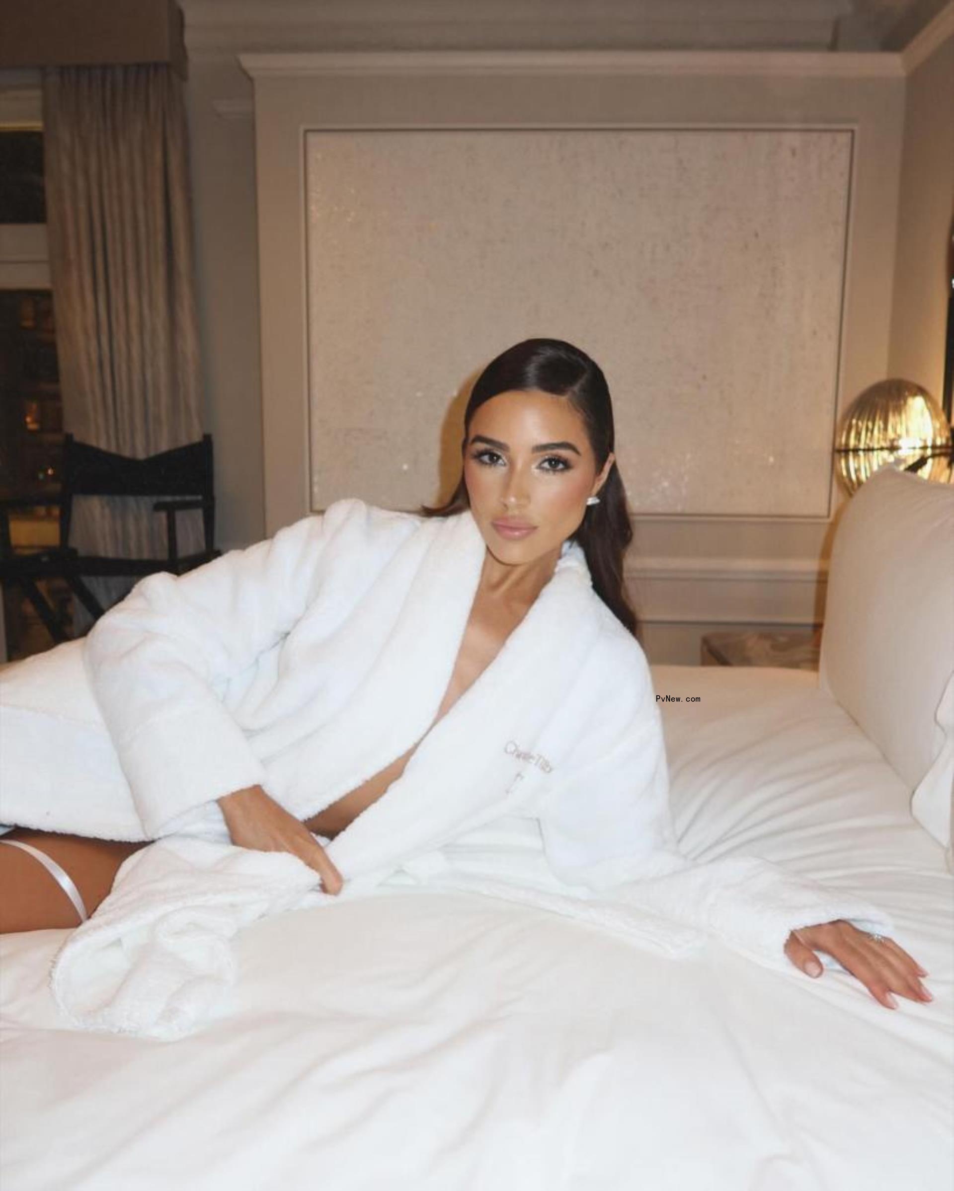 Olivia Culpo in a hotel robe.