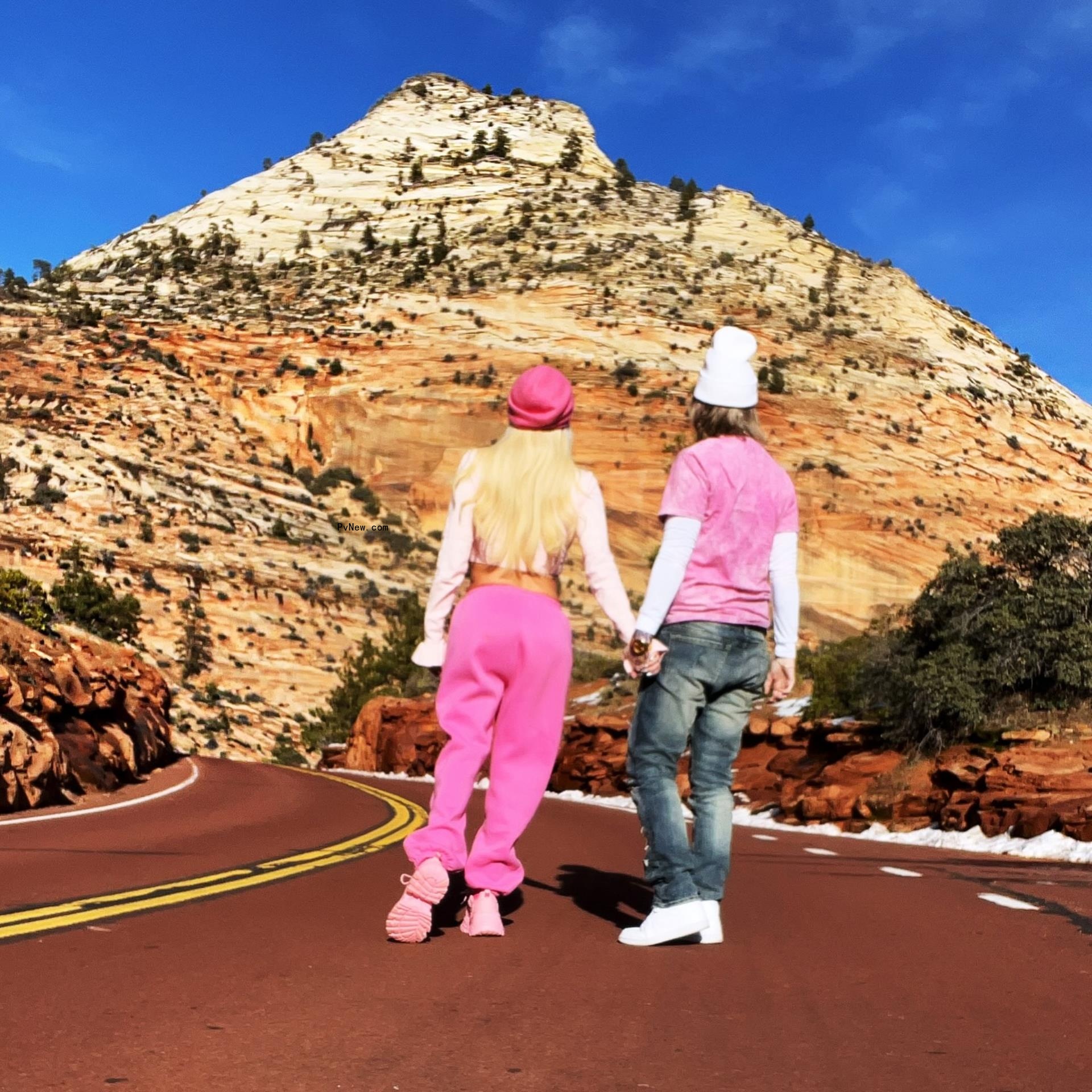 jenna jameson and jessi lawless holding hands looking at a desert mountain