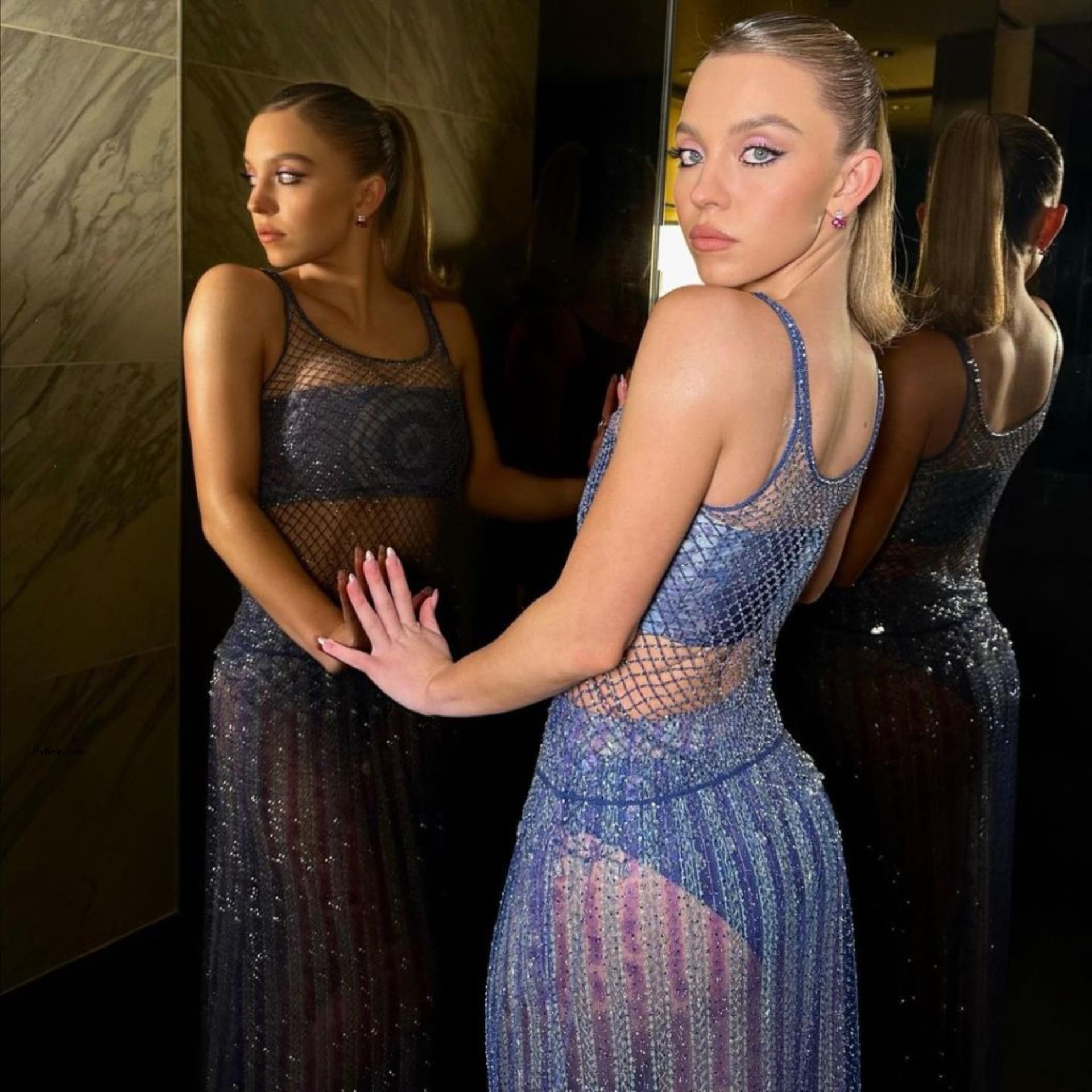 Sydney Sweeney in a blue dress. 