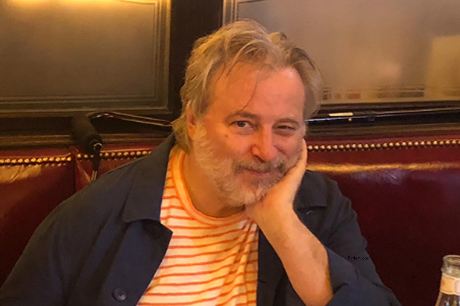 keith mcnally leaning his head in his hand