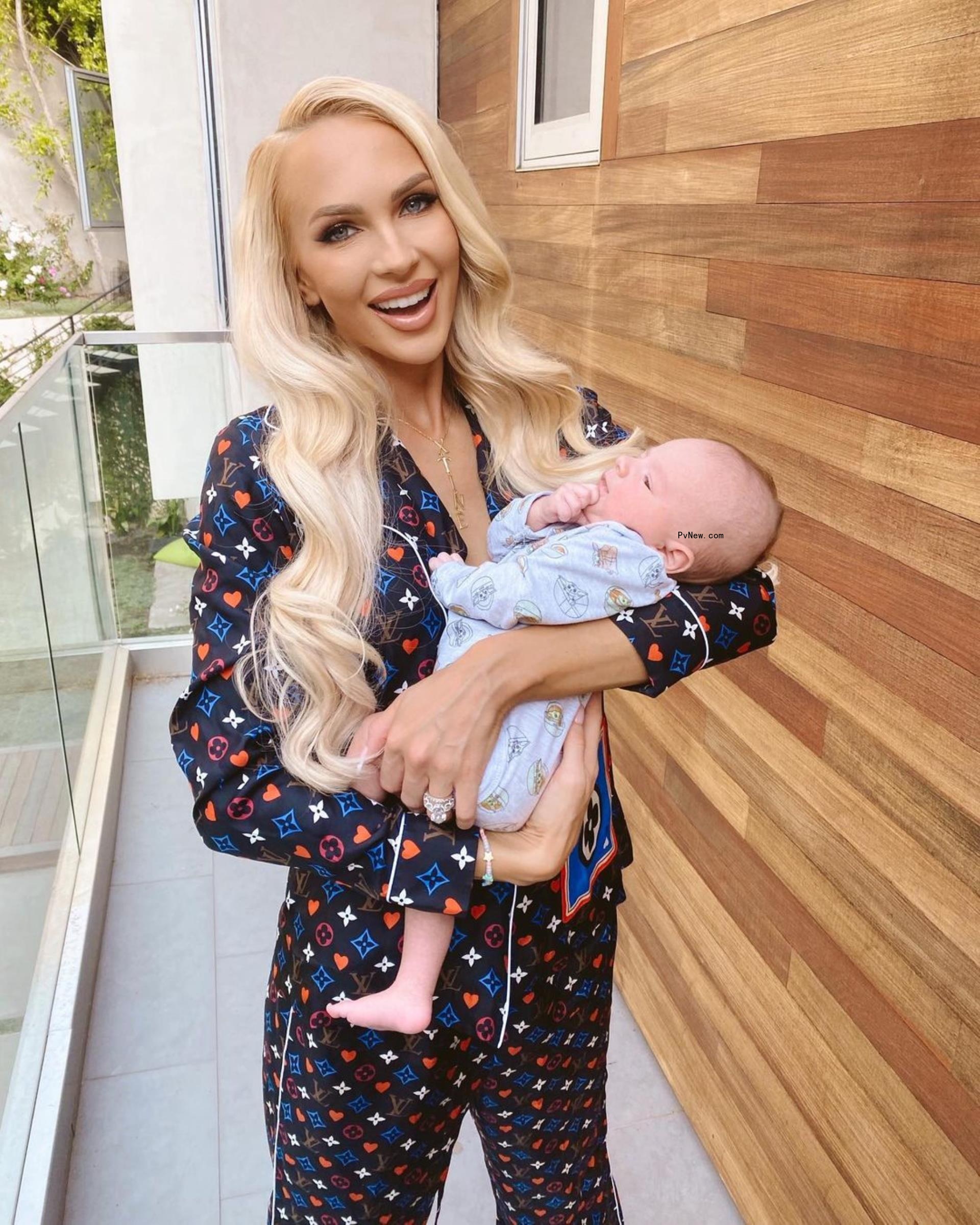 Christine Quinn holding her baby.