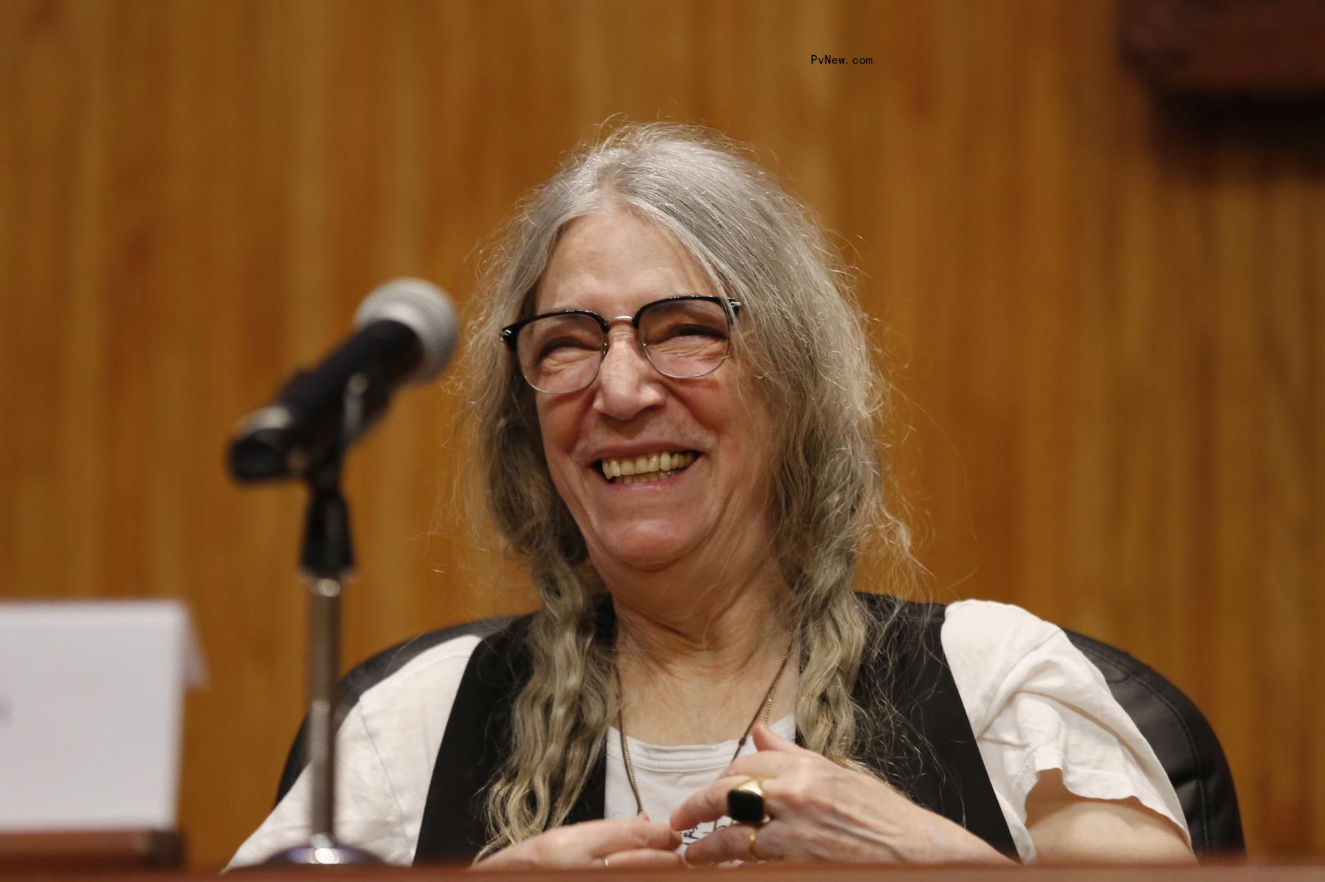 Patti Smith laughing in 2024.