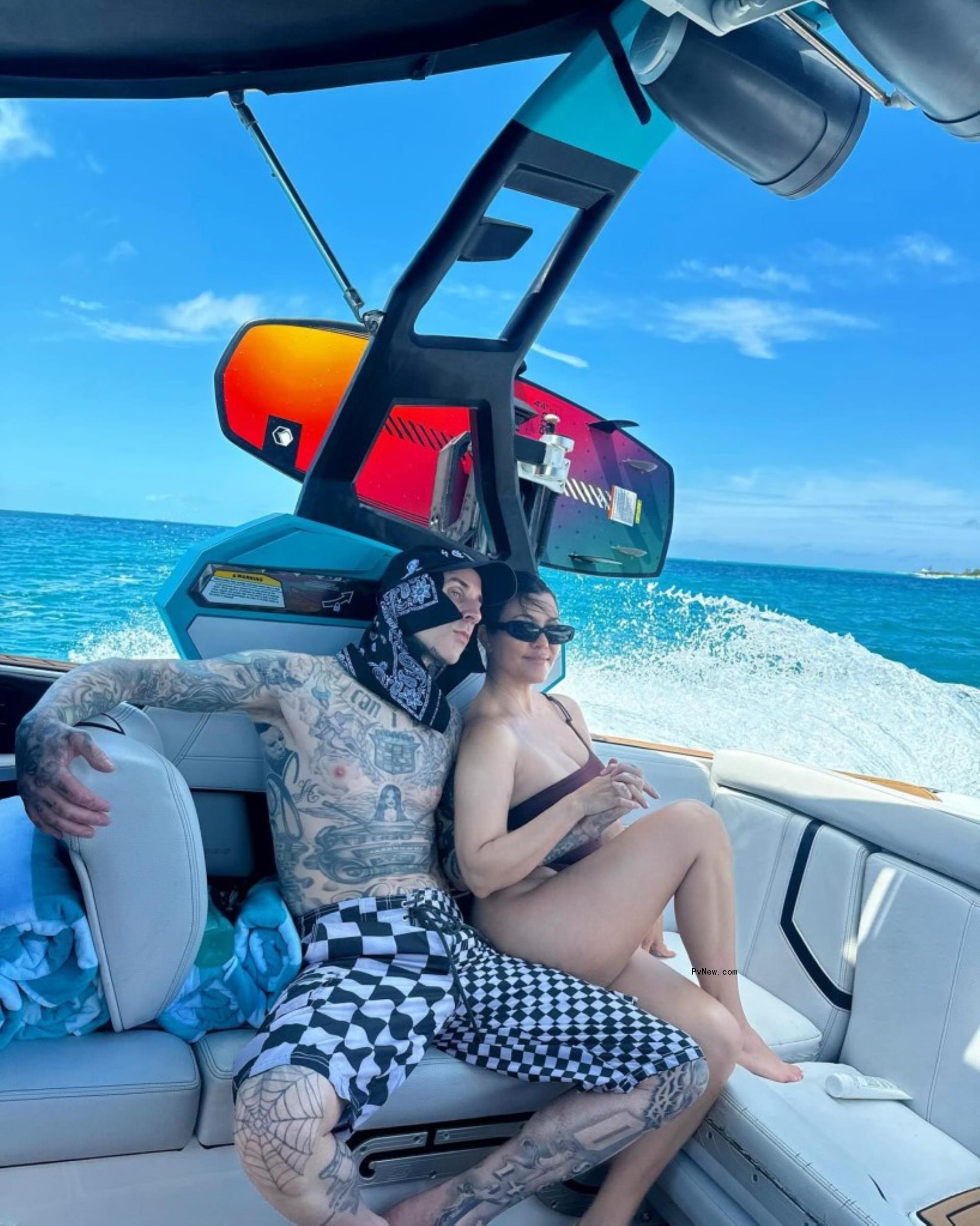 Kourtney Kardashian and Travis Barker on a boat