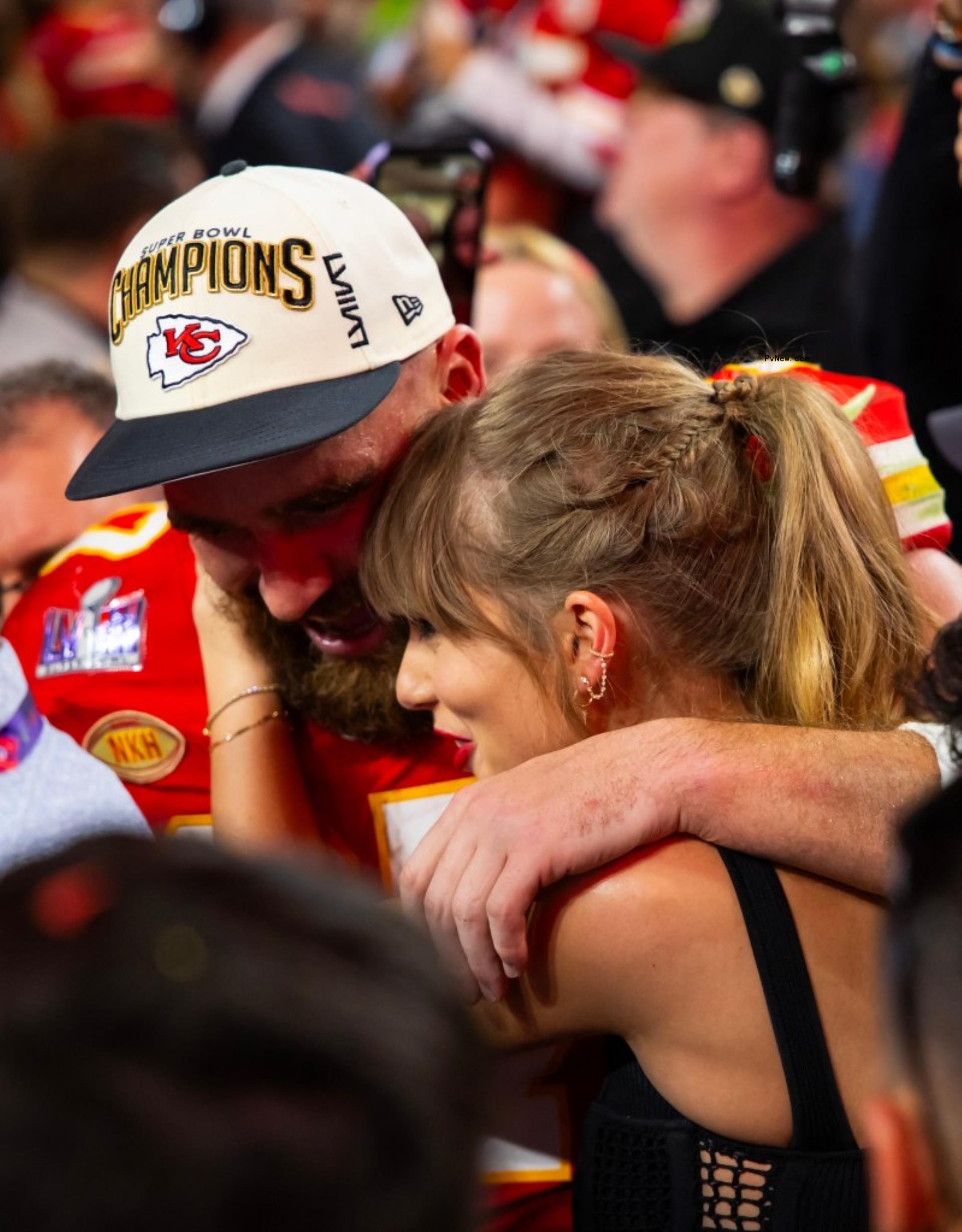 Travis Kelce and Taylor Swift hugging. at the 2024 Super Bowl.