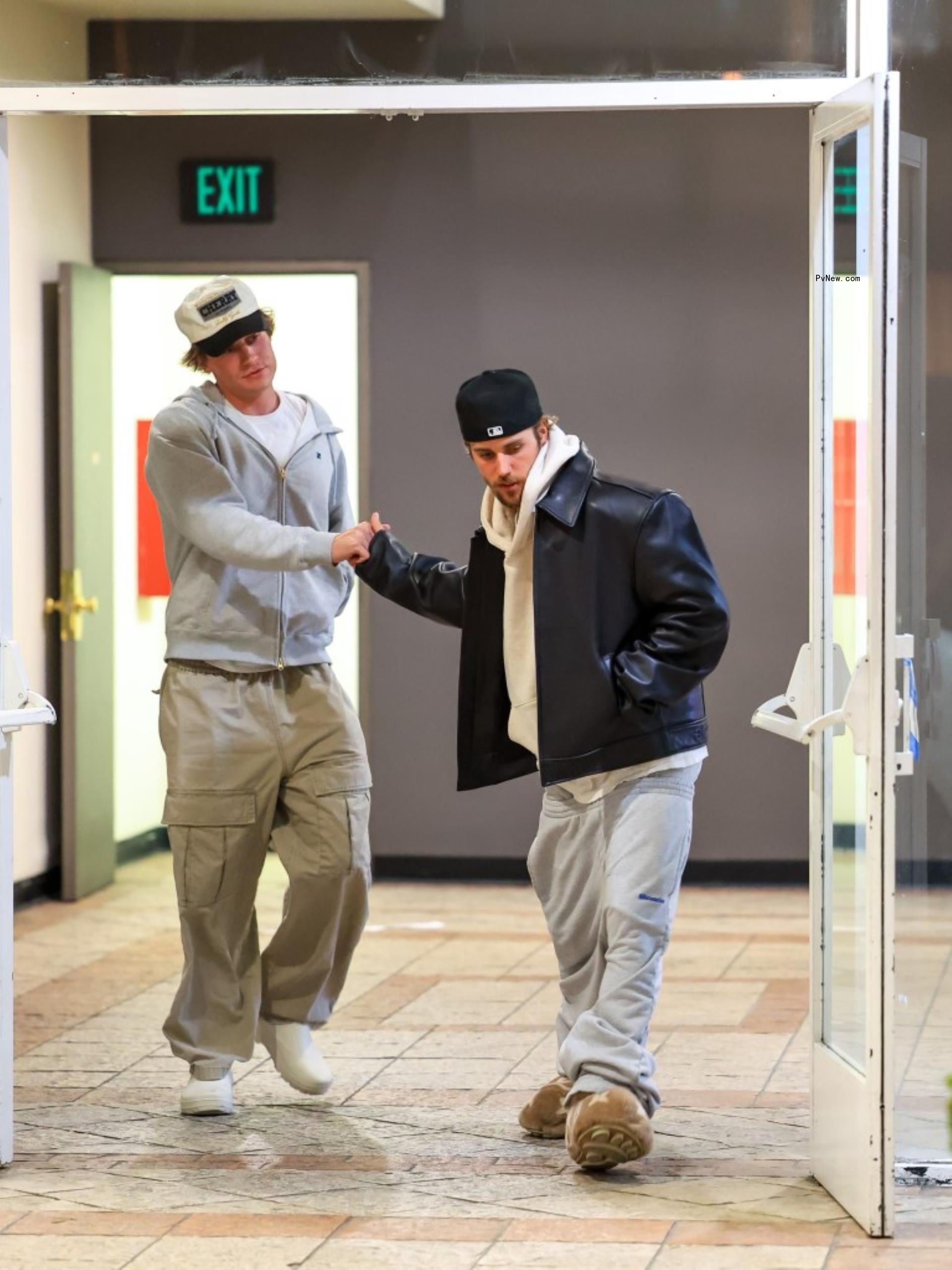 Justin Bieber wearing Louis Vuitton slippers and sweatpants