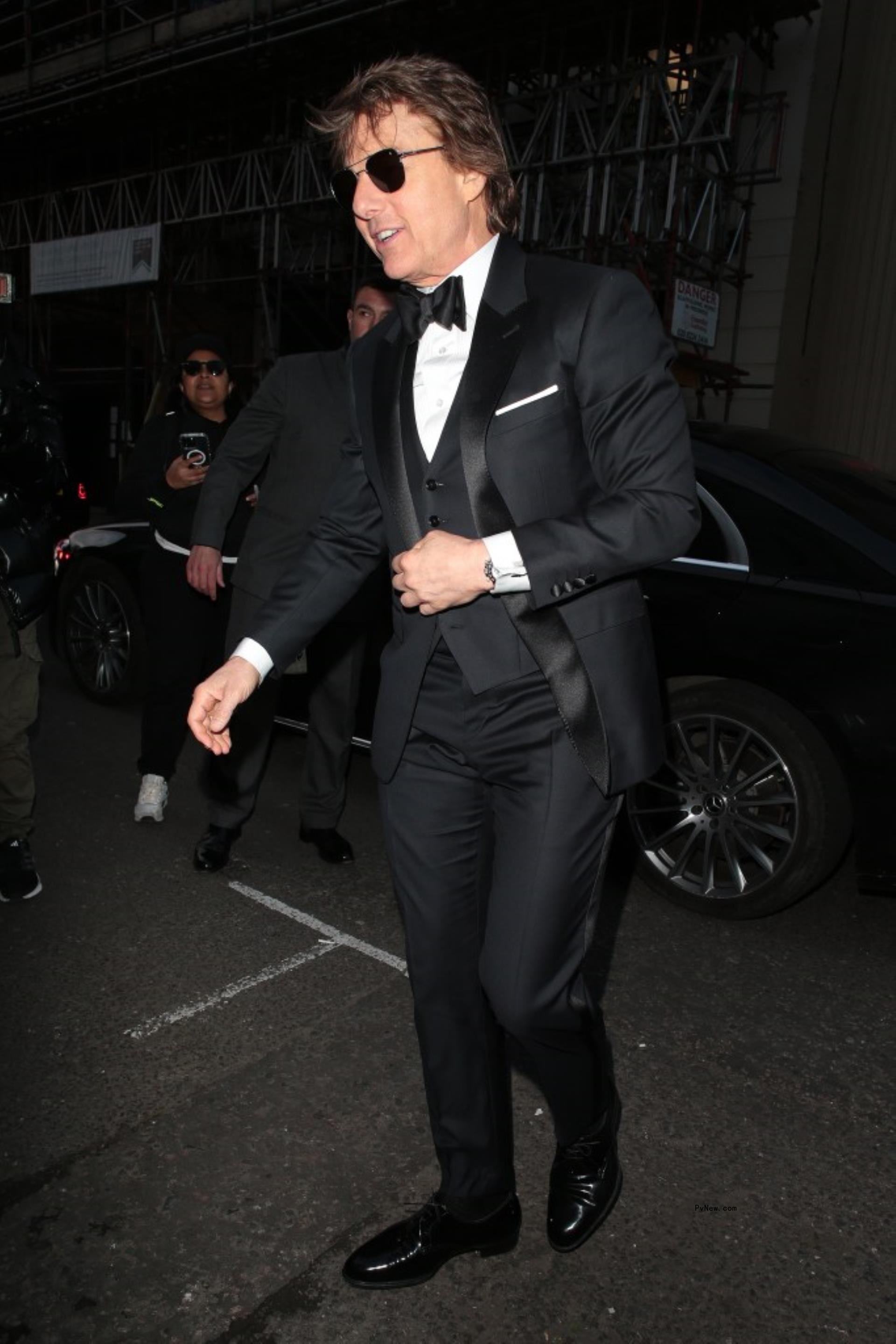 Tom Cruise arriving at Victoria Beckham's 50th birthday party