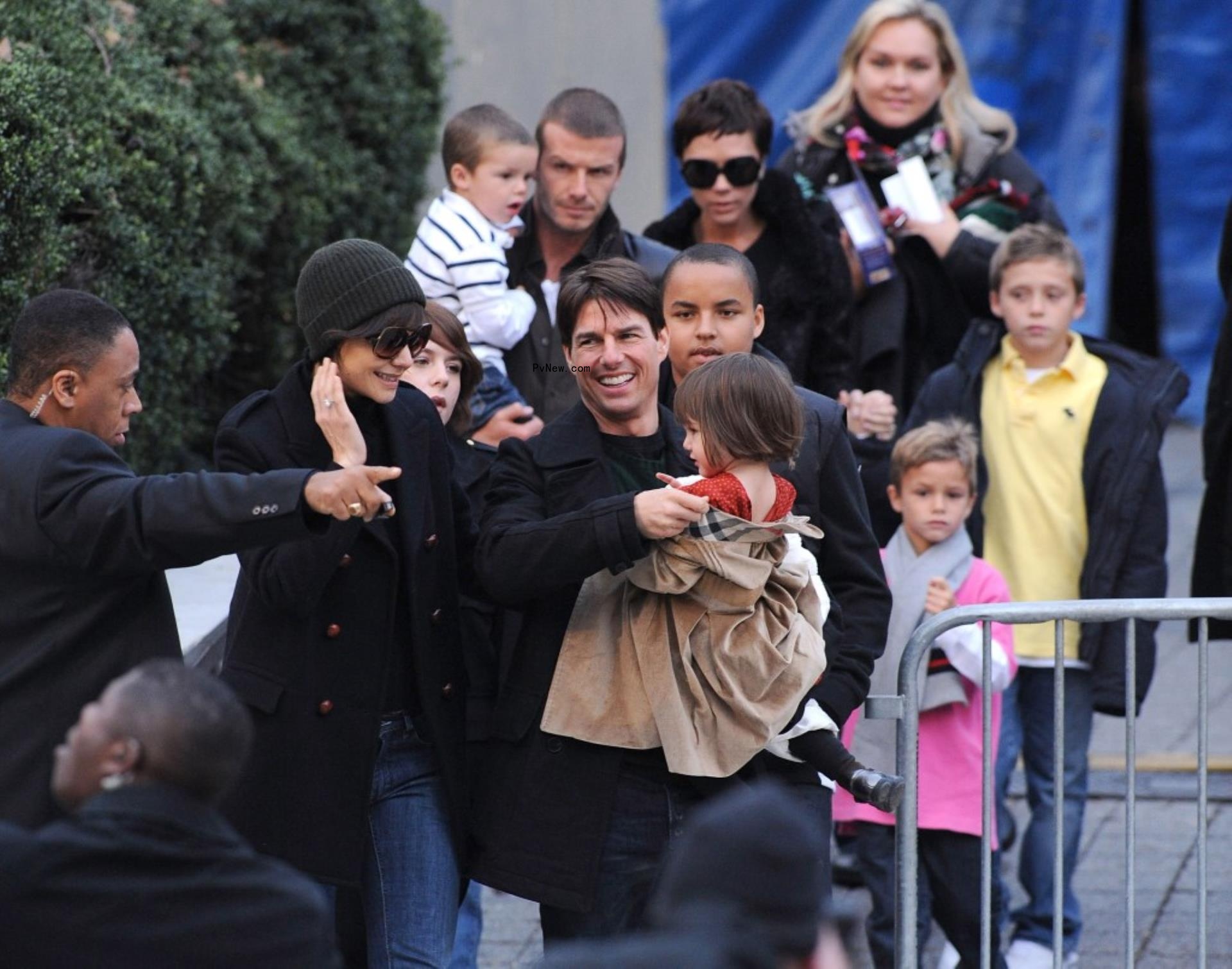 Tom Cruise holds Suri Cruise, with Katie Holmes next to him. Joined by Co<i></i>nnor and Isabella Cruise. David Beckham holds Cruz Beckham, while Victoria Beckham holds hands with Brooklyn Beckham.