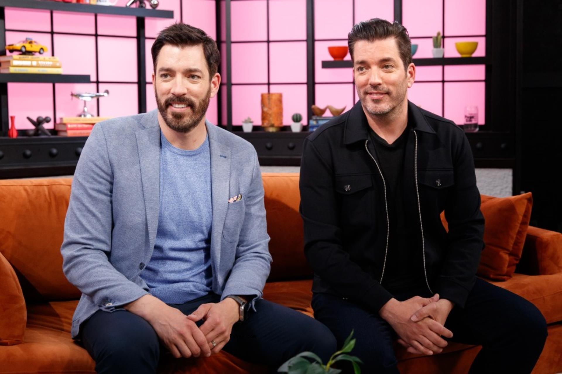 Drew and Jo<i></i>nathan Scott pose on a couch