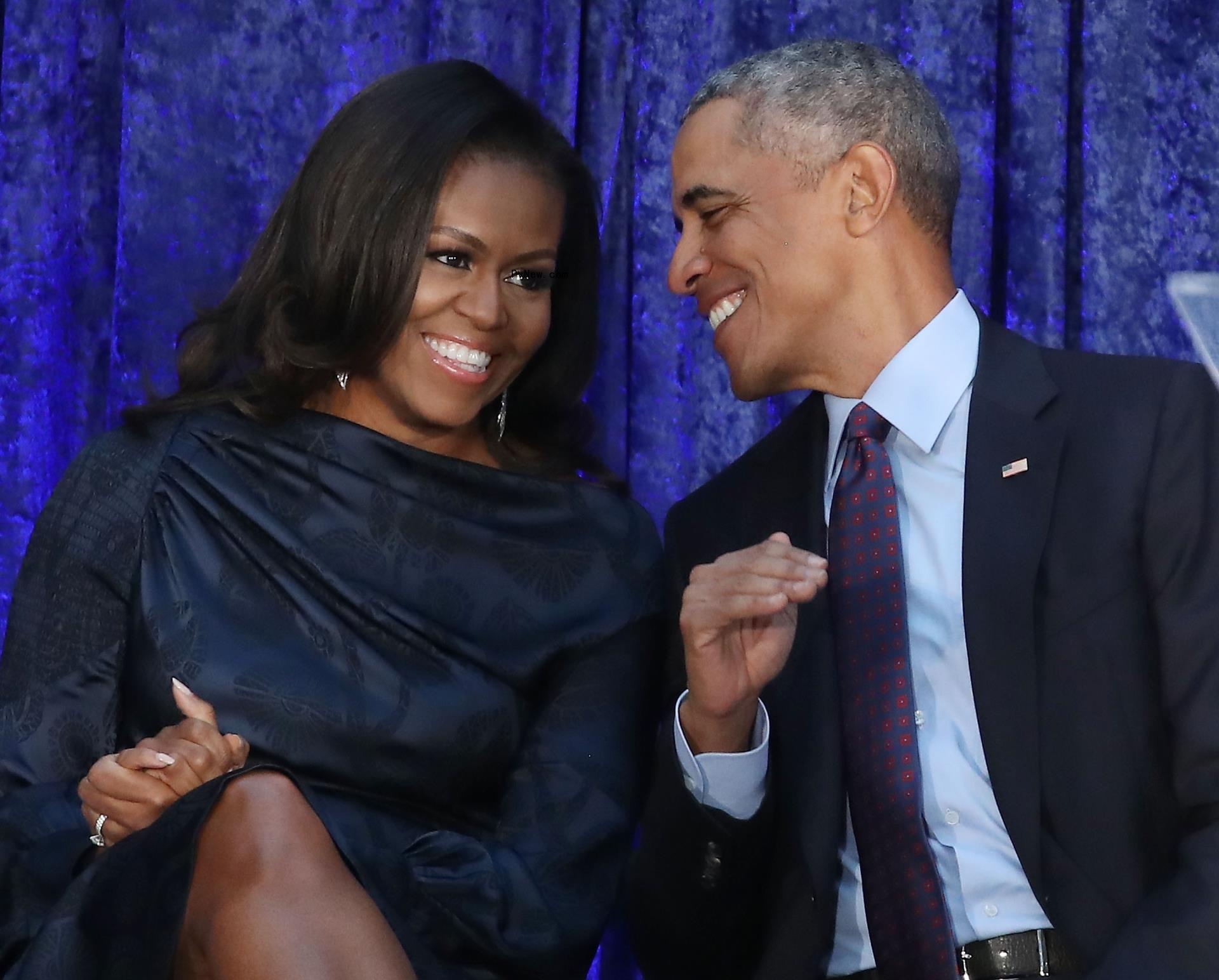 Michelle Obama and Barack Obama chatting.