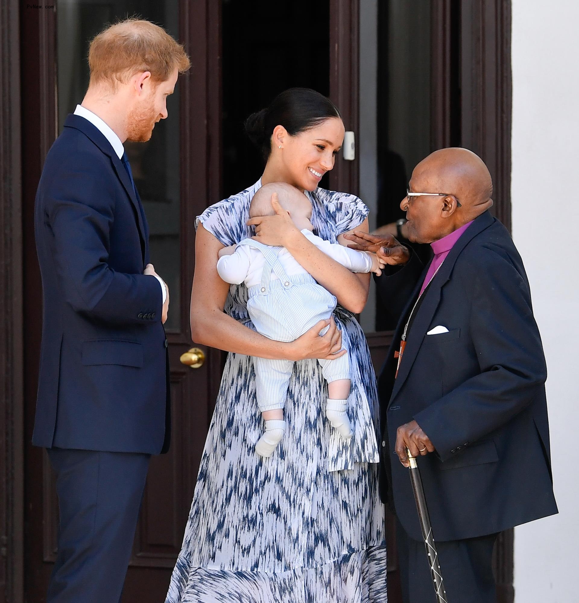 Prince Harry and Meghan Markle with son and Desmond Tutu.