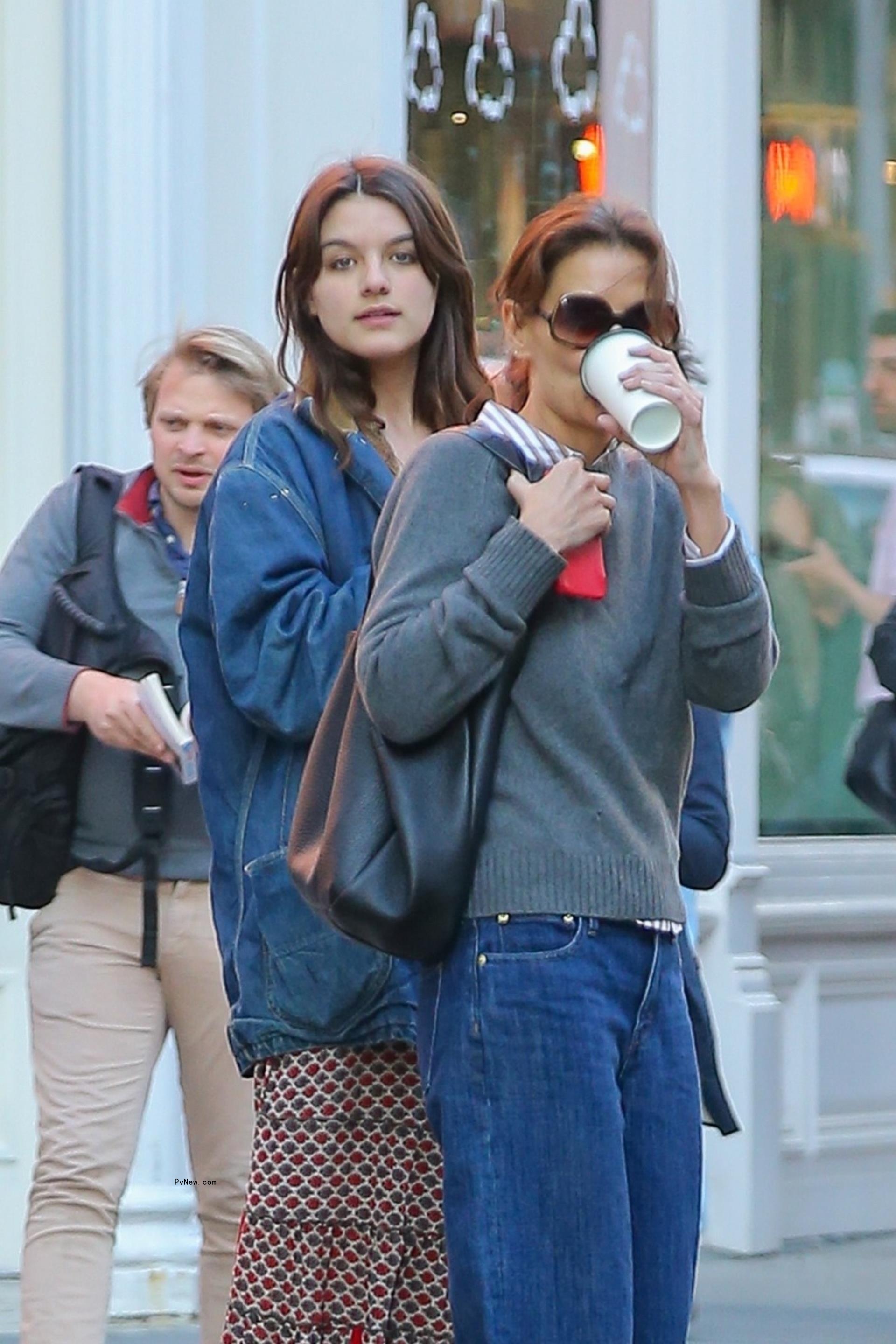 Katie Holmes and Suri Cruise getting coffee in New York City.