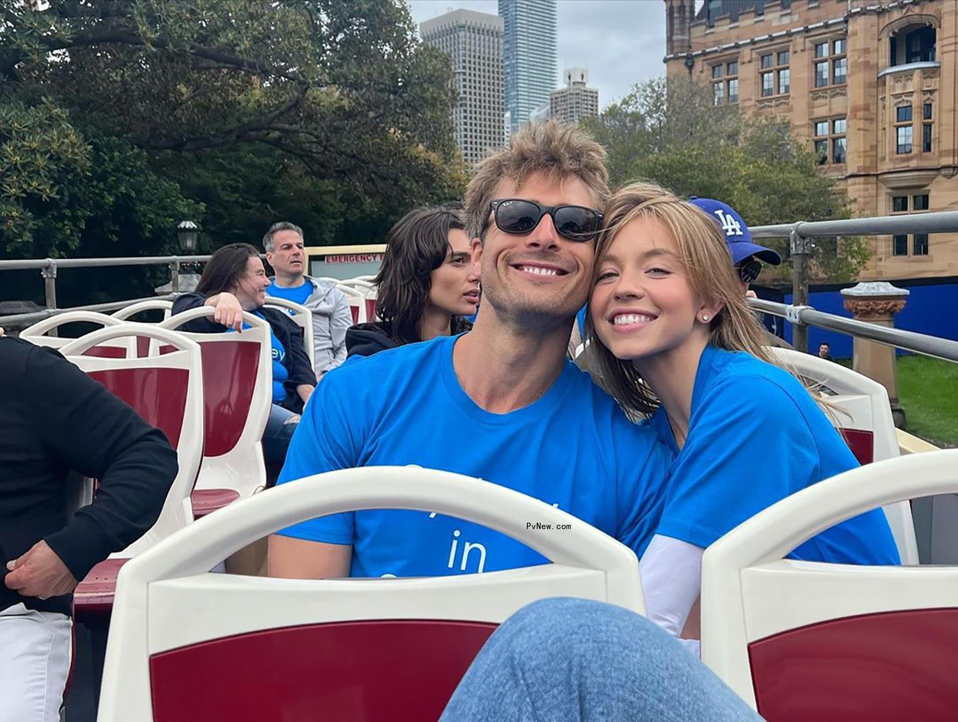 Glen Powell and Sydney Sweeney on a bus.