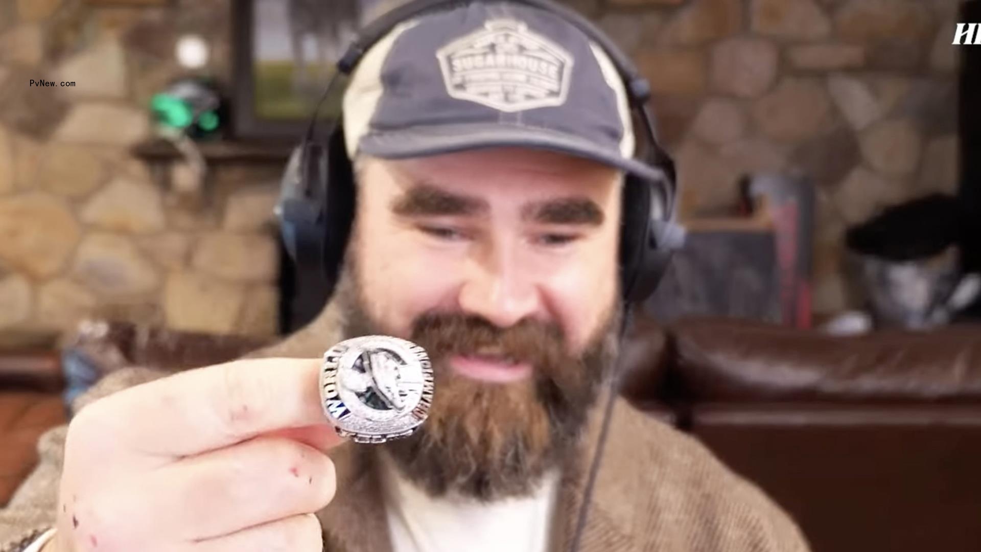 Jason Kelce holding his Super Bowl ring.