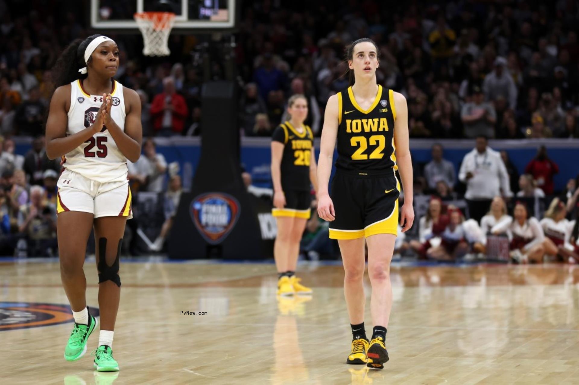 Caitlin Clark playing basketball.