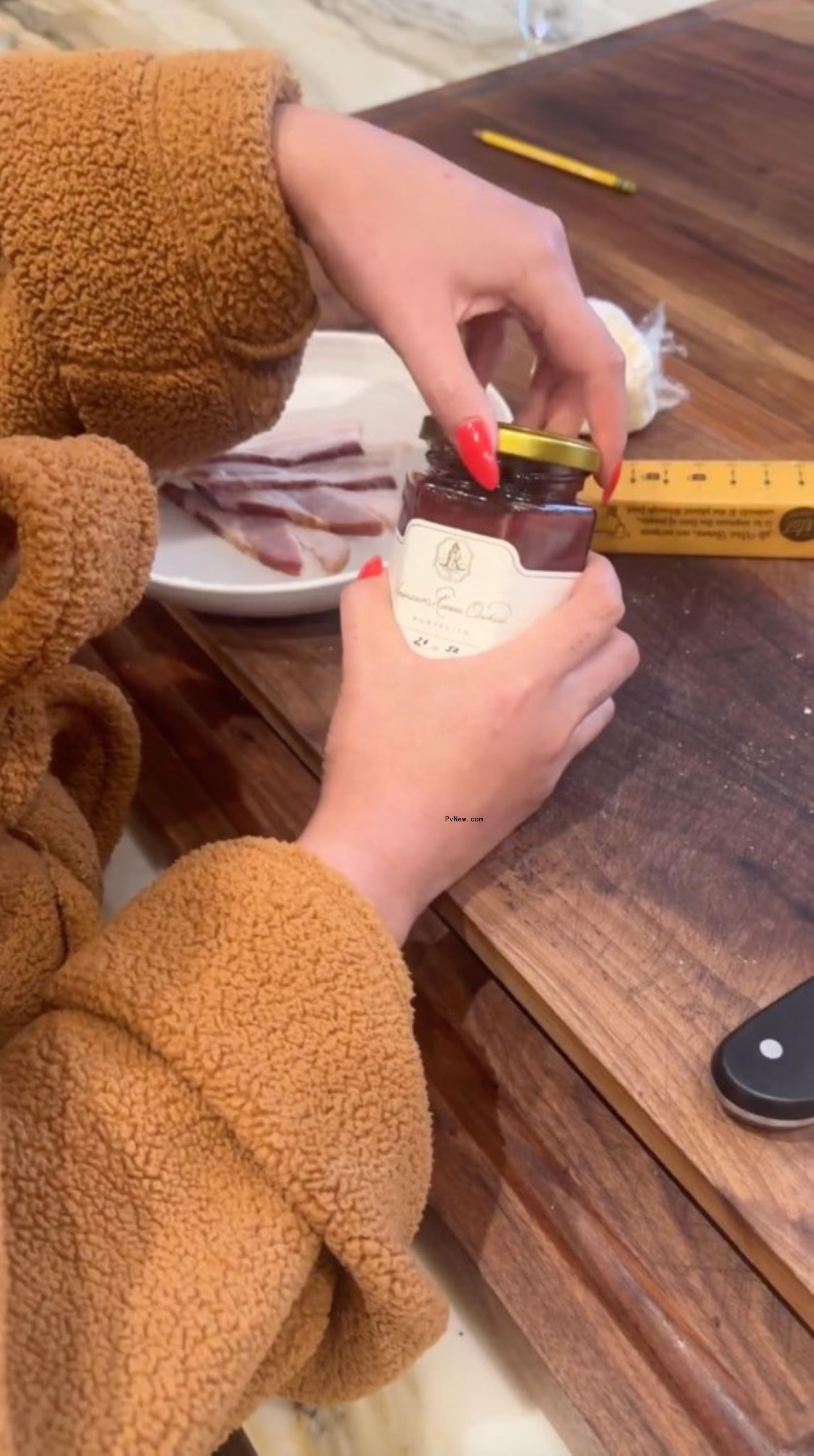 Chrissy Teigen cooking with Meghan Markle's jam.