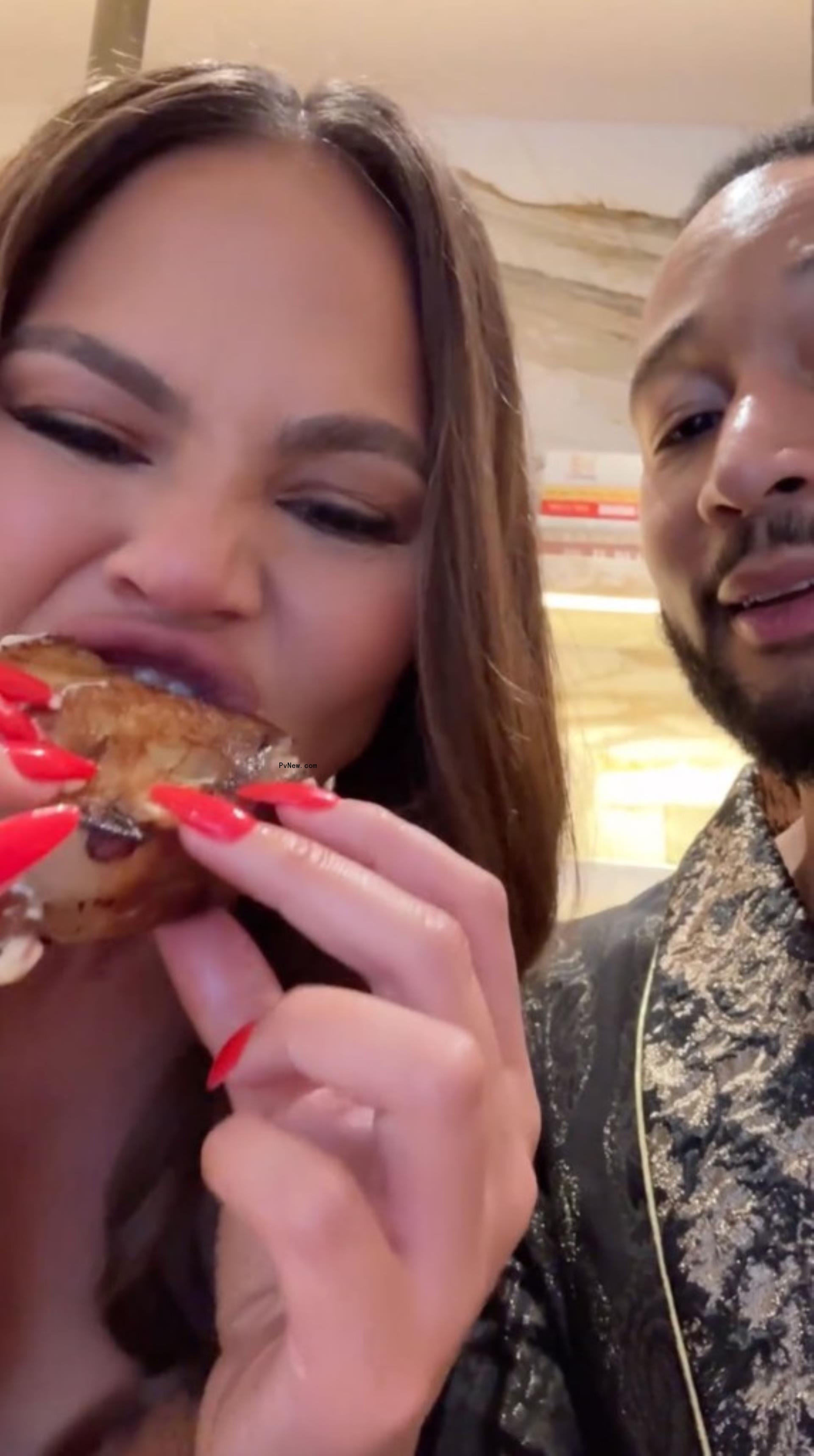 Chrissy Teigen and John Legend eating a sandwich with Meghan Markle's jam.