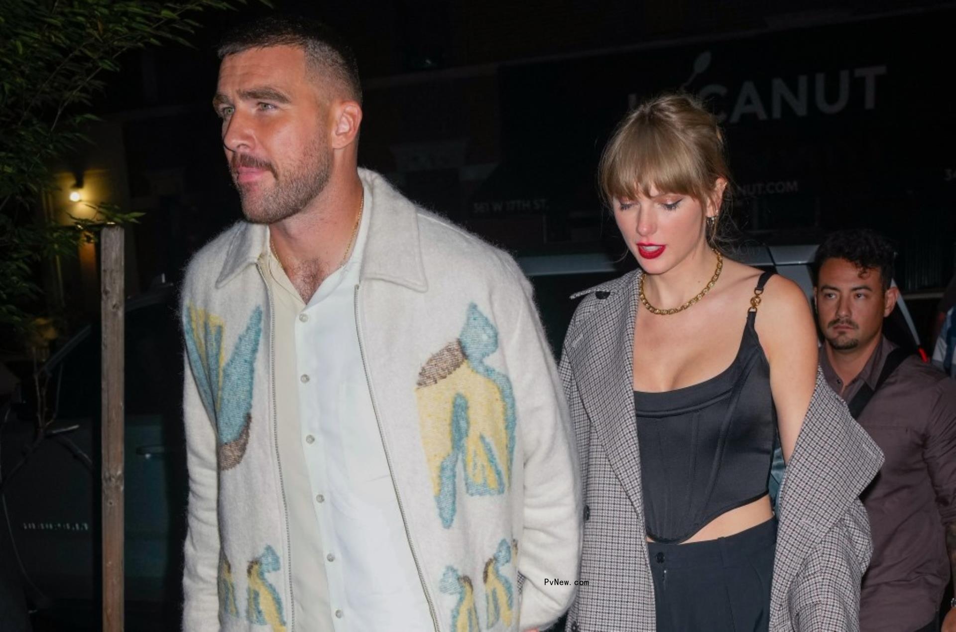 Taylor Swift and Travis Kelce hold hands