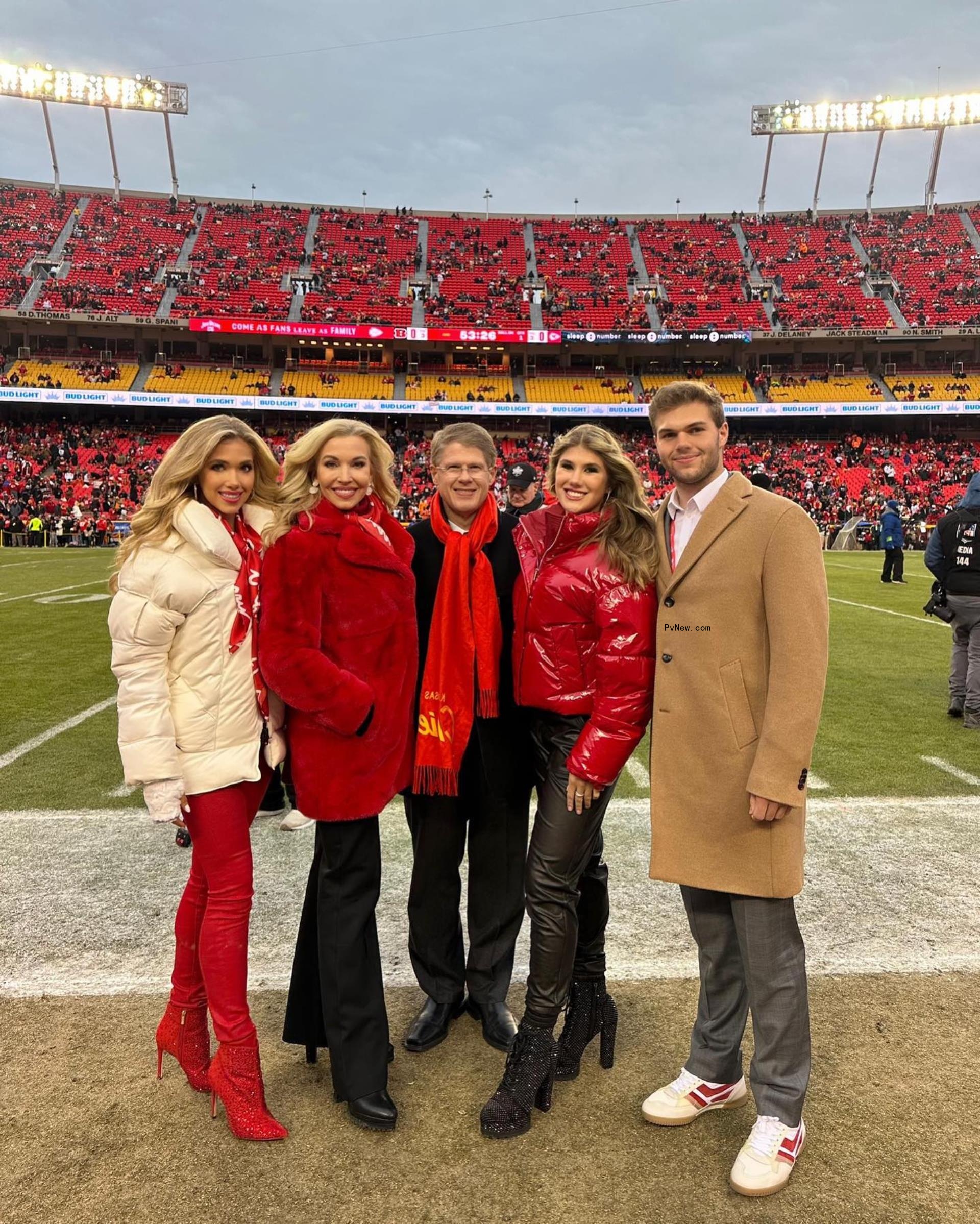 The Hunt family on a football field.