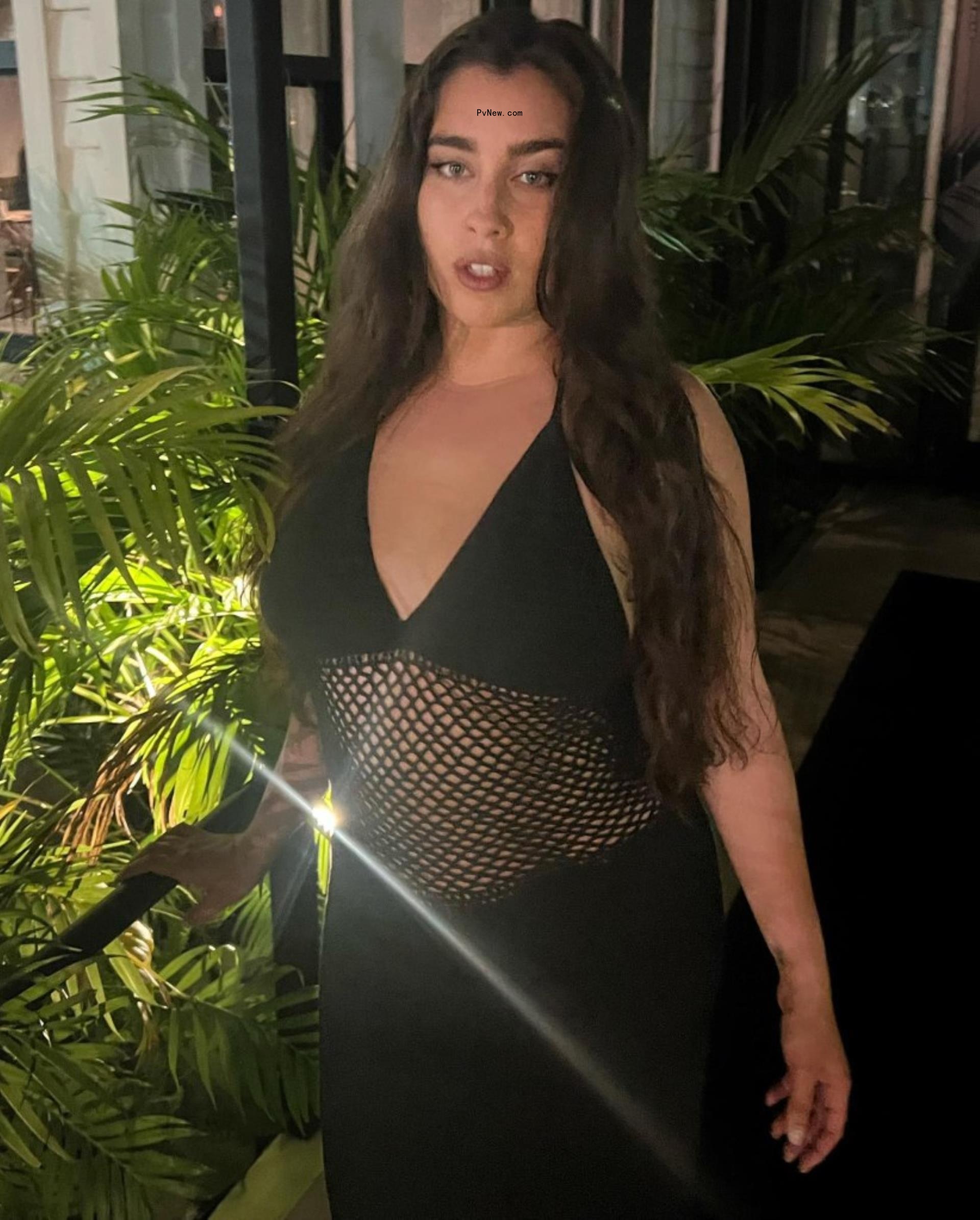Lauren Jauregui in a black dress.