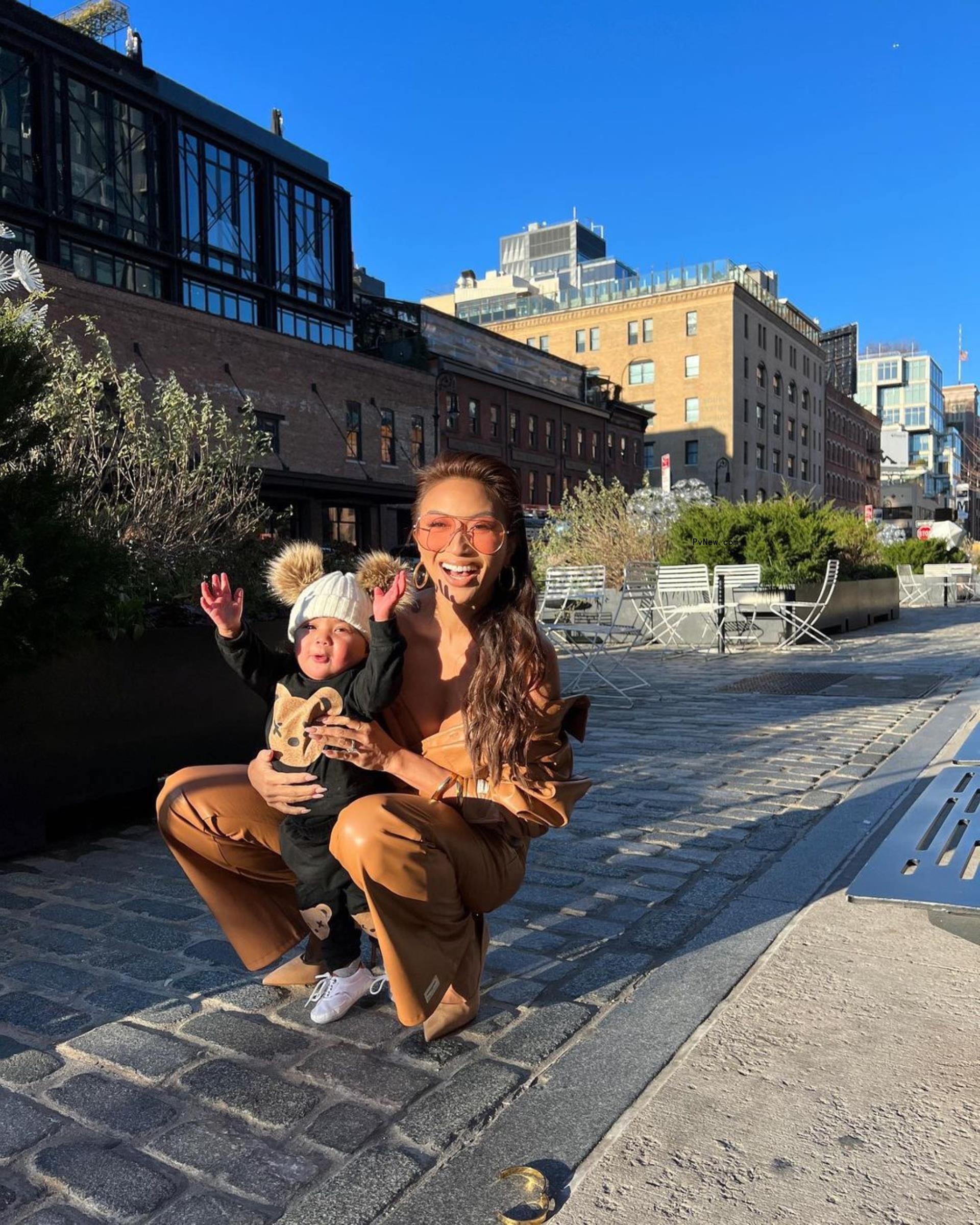 Jeannie Mai holding her daughter, Monaco.