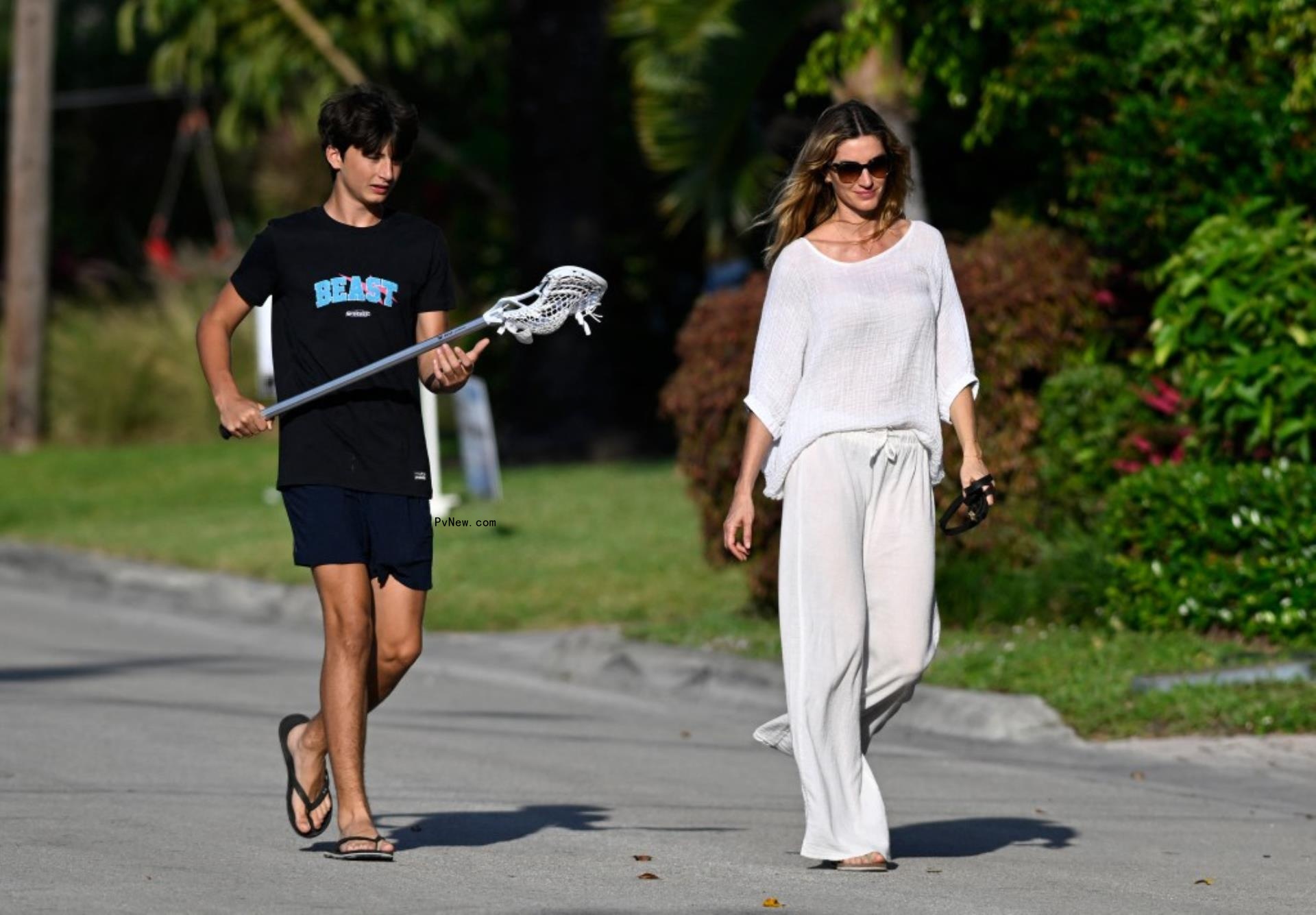 A giant screen on a building in Times Square showing Shakira singing with flames in front.