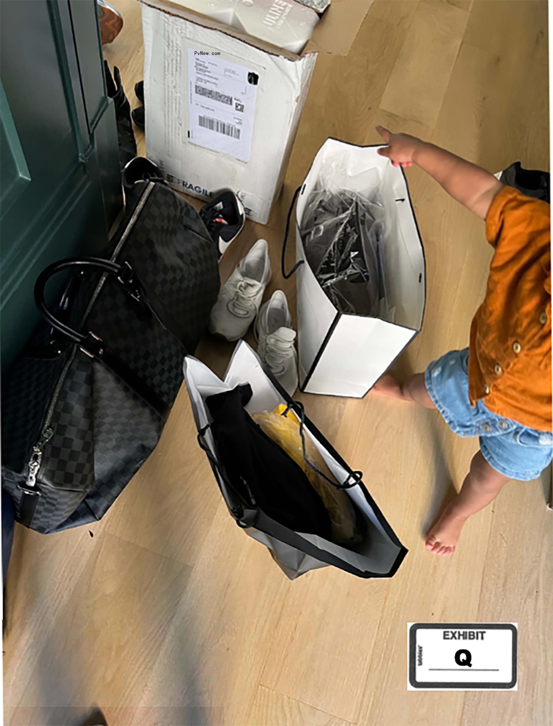 Mo<i></i>naco near Jeezy's Louis Vuitton bag.