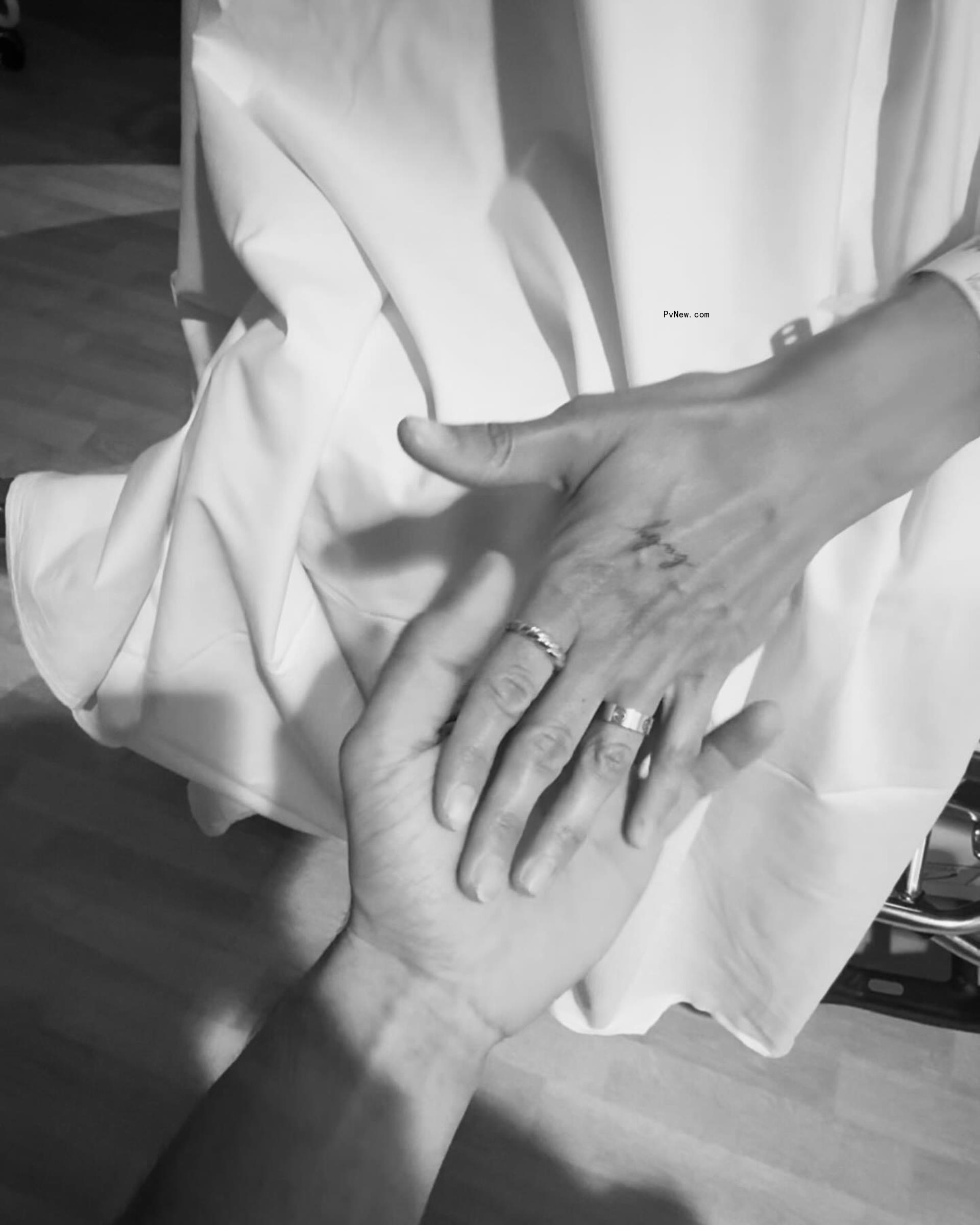 Mo<i></i>nica Garcia's hand on someone else's hand
