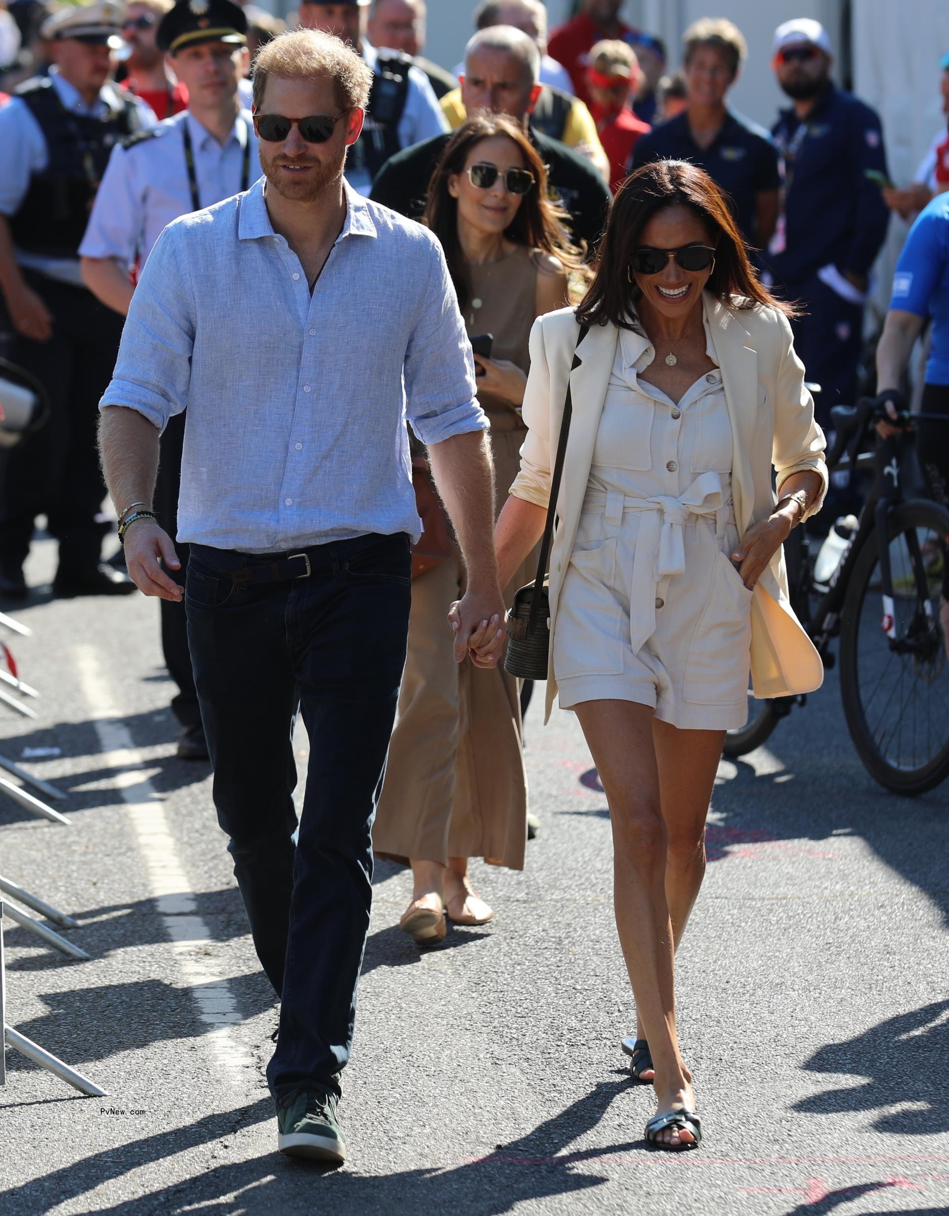 Prince Harry and Meghan Markle holding hands